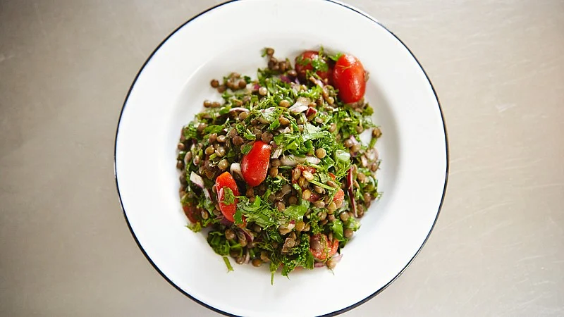 Catherine-Cuello-drains-lentils-for-her-French-Lentils-and-a-Ton-of-Herbs-recipe-Foodadit.jpg
