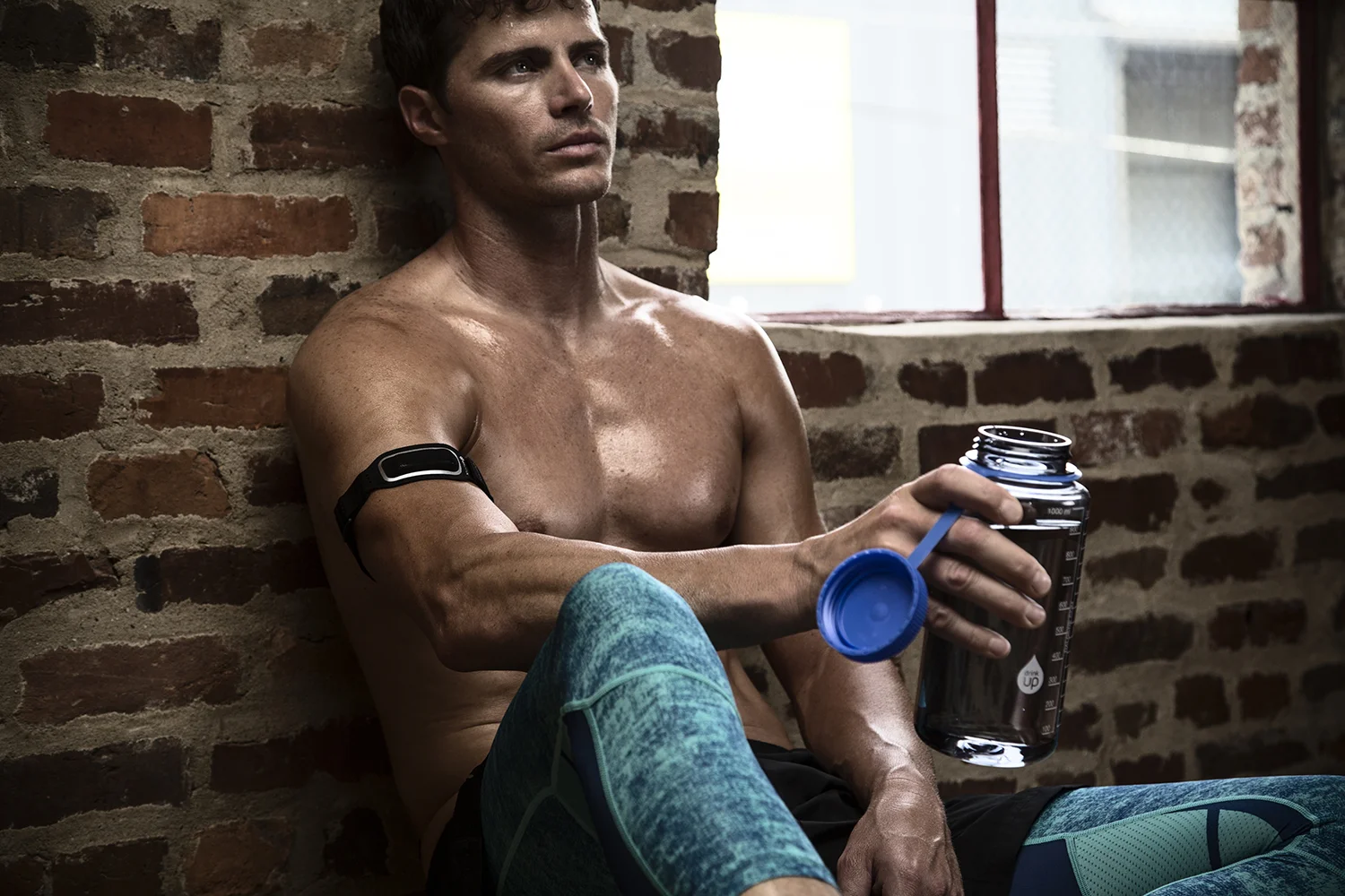 Fitness Sitting against brick wall G.jpg