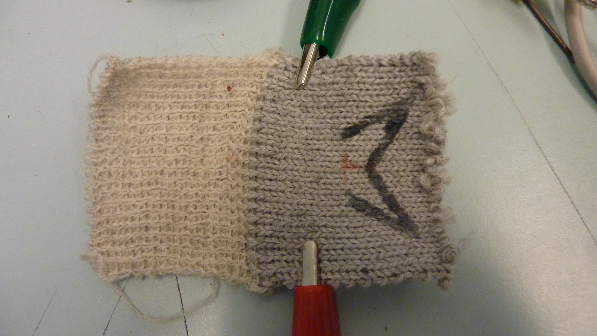  Applying a current through the resistive yarn warms the fabric and the ink fades 