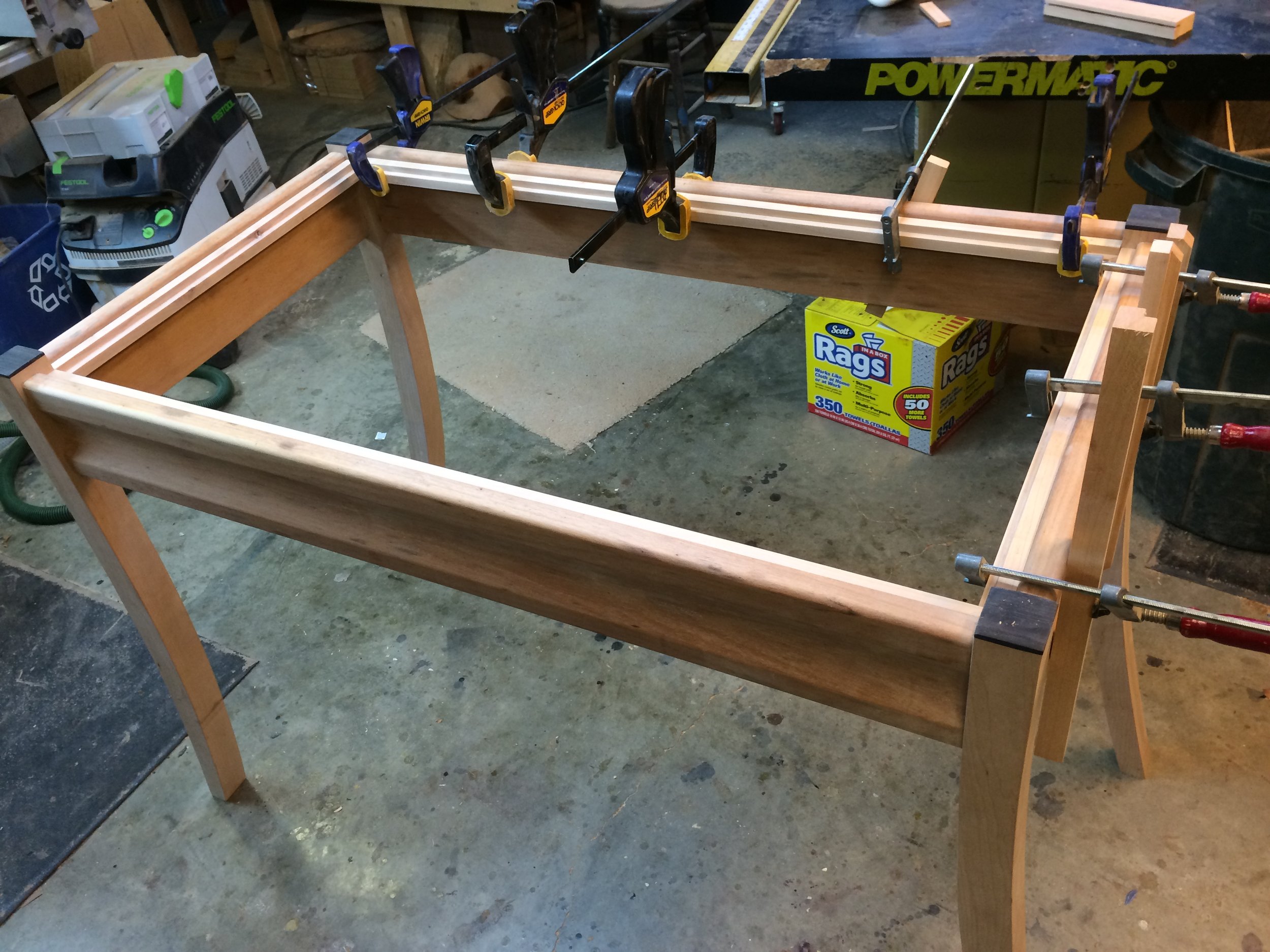 The ledge is glued to the inside perimeter of the apron.