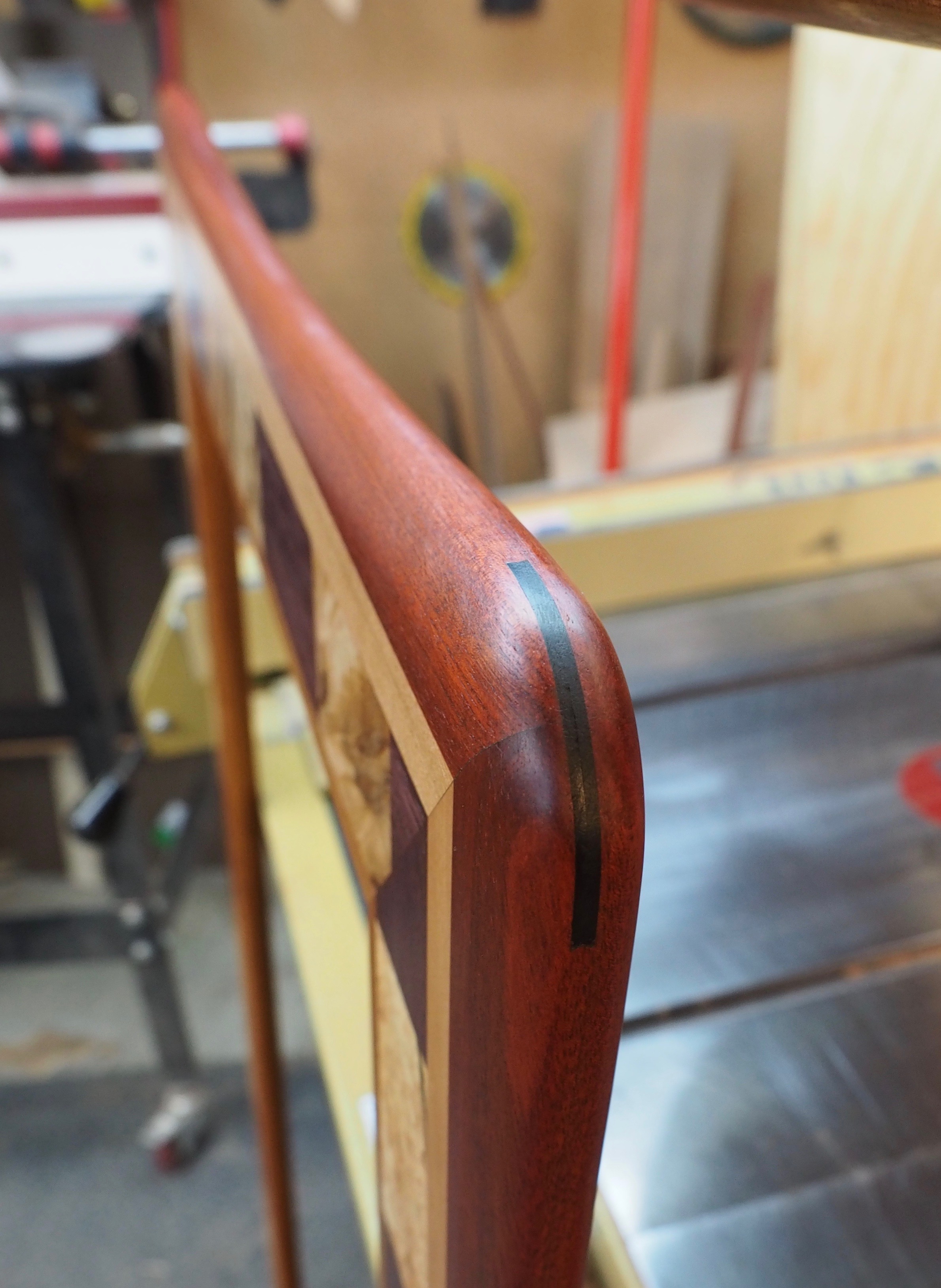 Here is an ebony spline on the corner of the Bayfield Burl Mirror. I have to say - I love ebony! It adds a powerful sense of drama to art furniture.