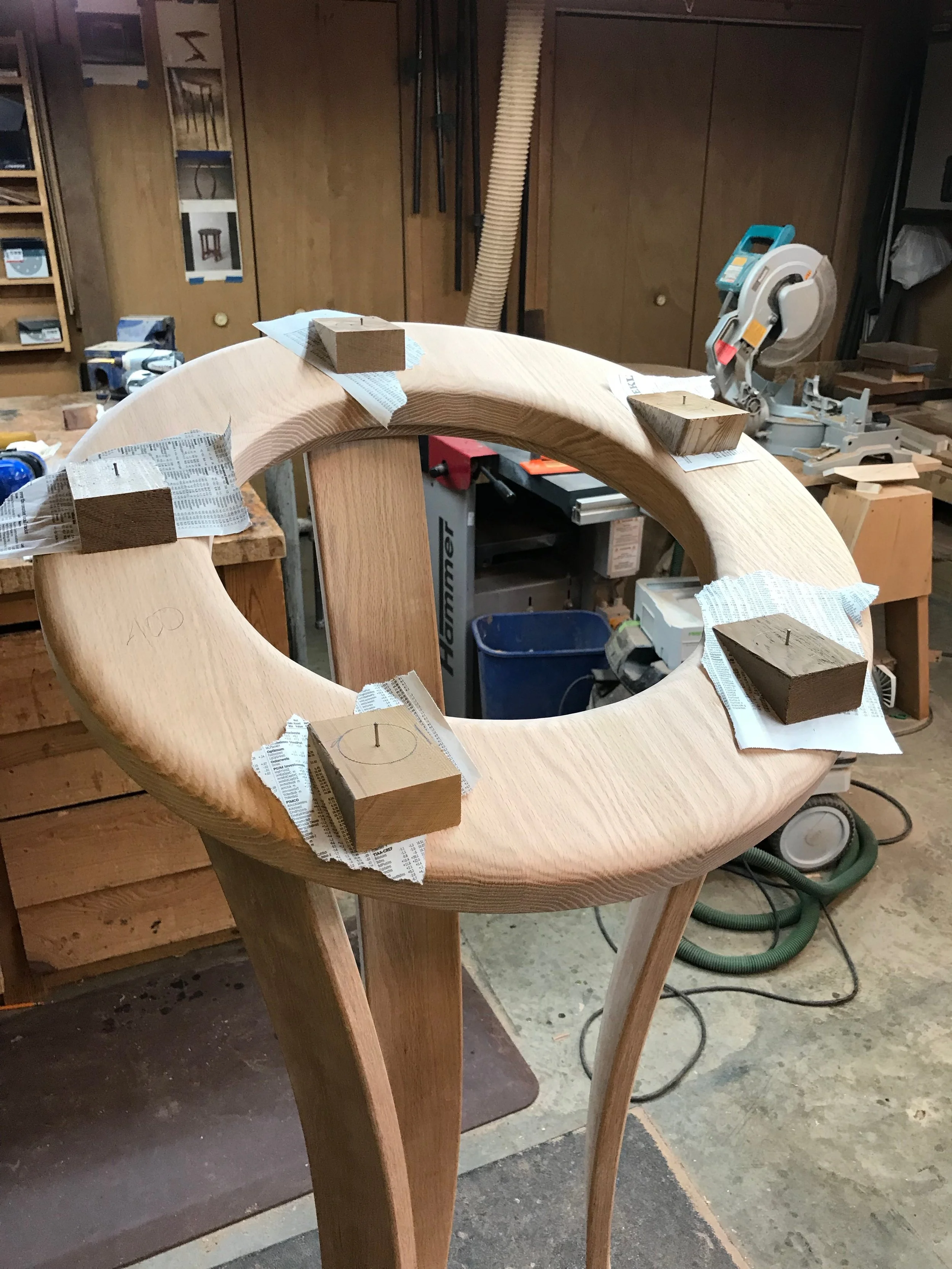 The socket locations are marked with cedar glue blocks and a small nail to mark the center for accuracy.