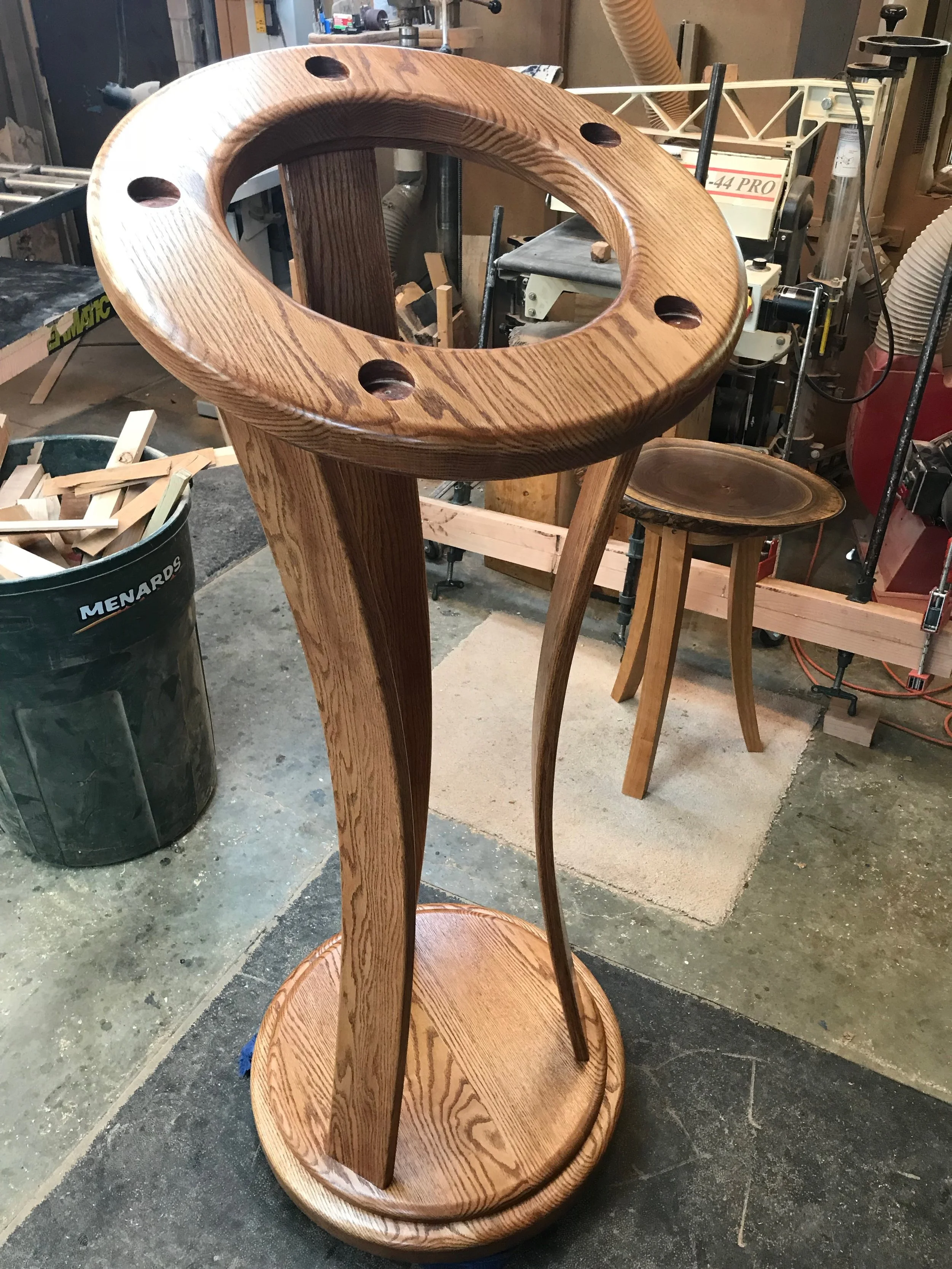Following staining and multiple finish coats, and prior to the brushed brass socket installation.