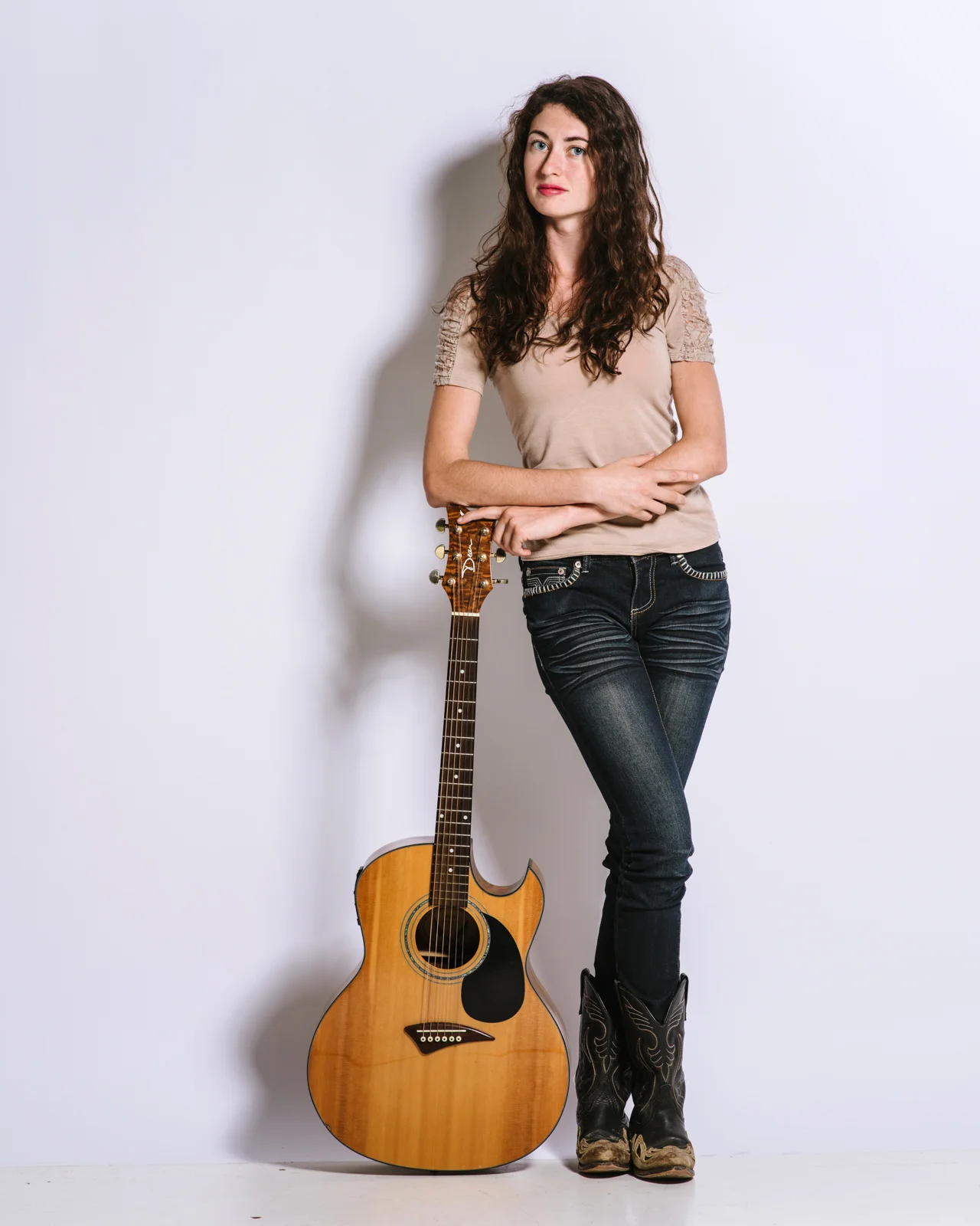Kendra Warren modeling with her guitar for The Enchanted Forrest - Asheville, NC