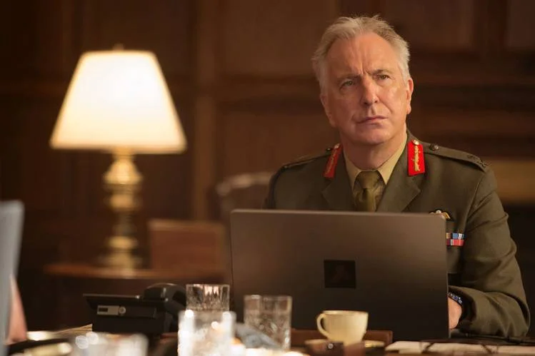 Rickman, looking at an idiot politician with disgust and incredulousness, no doubt