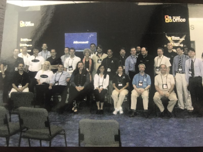 Our First Office System Demo Theatre in the Expo Hall, Circa 2003. Me, middle, headset.