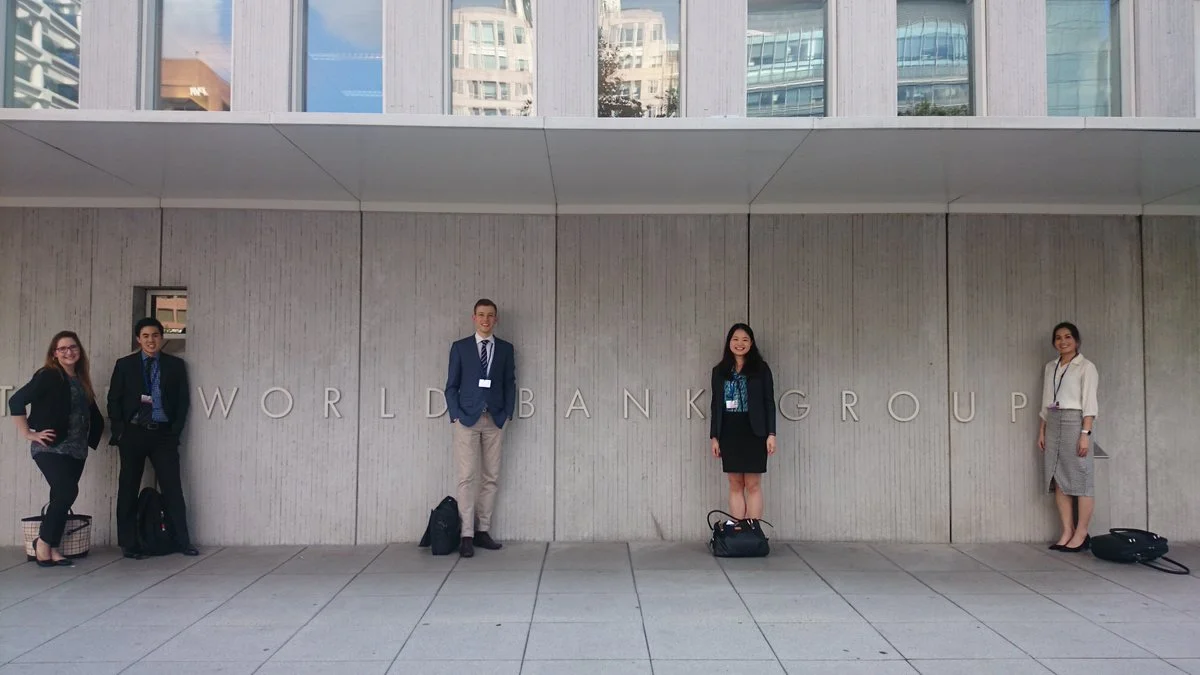 Delegates pose for a photo in front of the World Bank Group HQ. (L-R) Sarah-Joy Pierce (QUT Business School), Tony Chen (University of Melbourne, Faculty of Business and Economics), Tom Perfrement (UNSW Co-op Scholar), Susan Deng (UNSW Co-op Scholar) and Almira De Vera (University of South Australia).