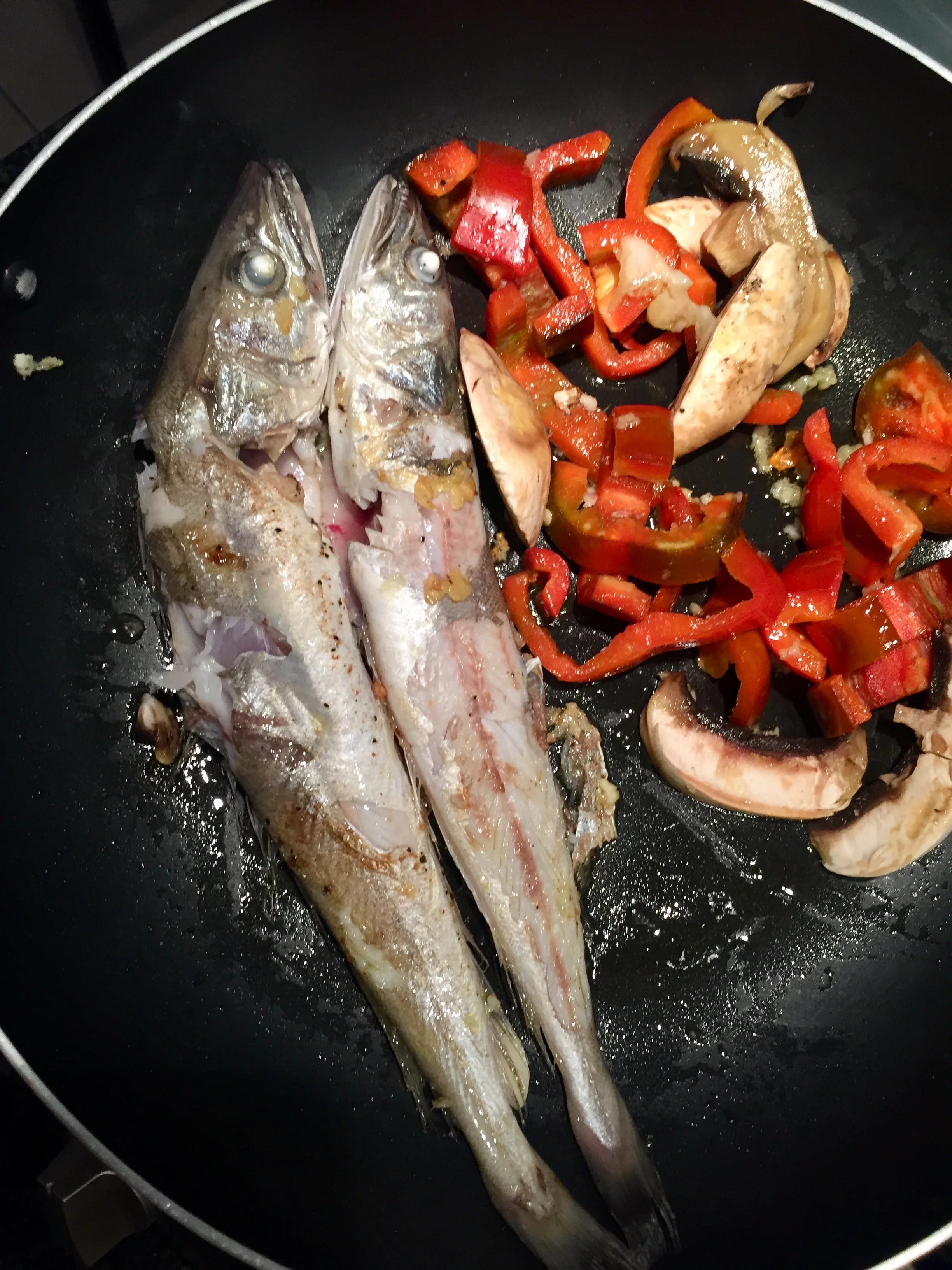 Pan fried hake with homegrown peppers.