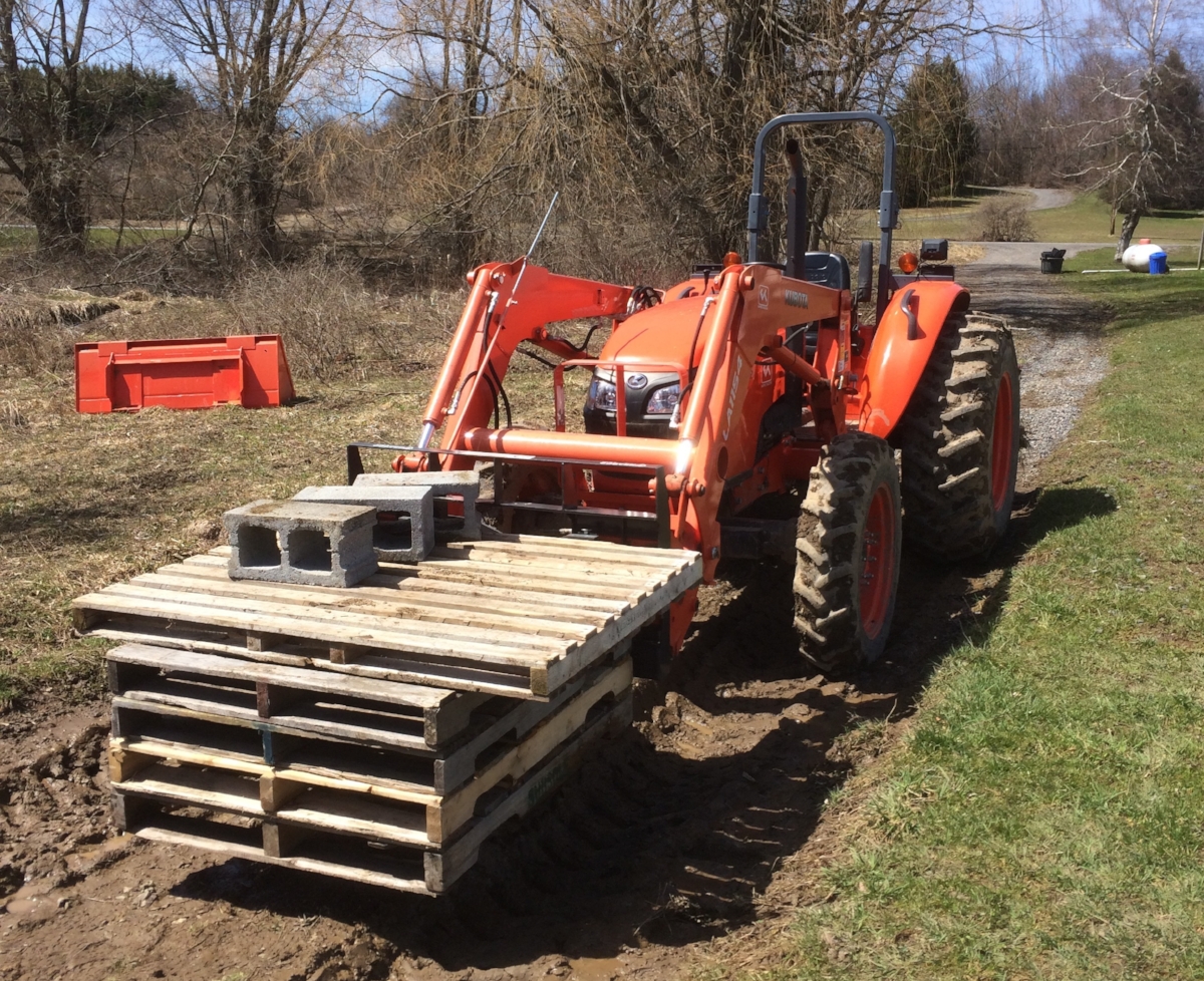 Using the forks on the front to move things around!