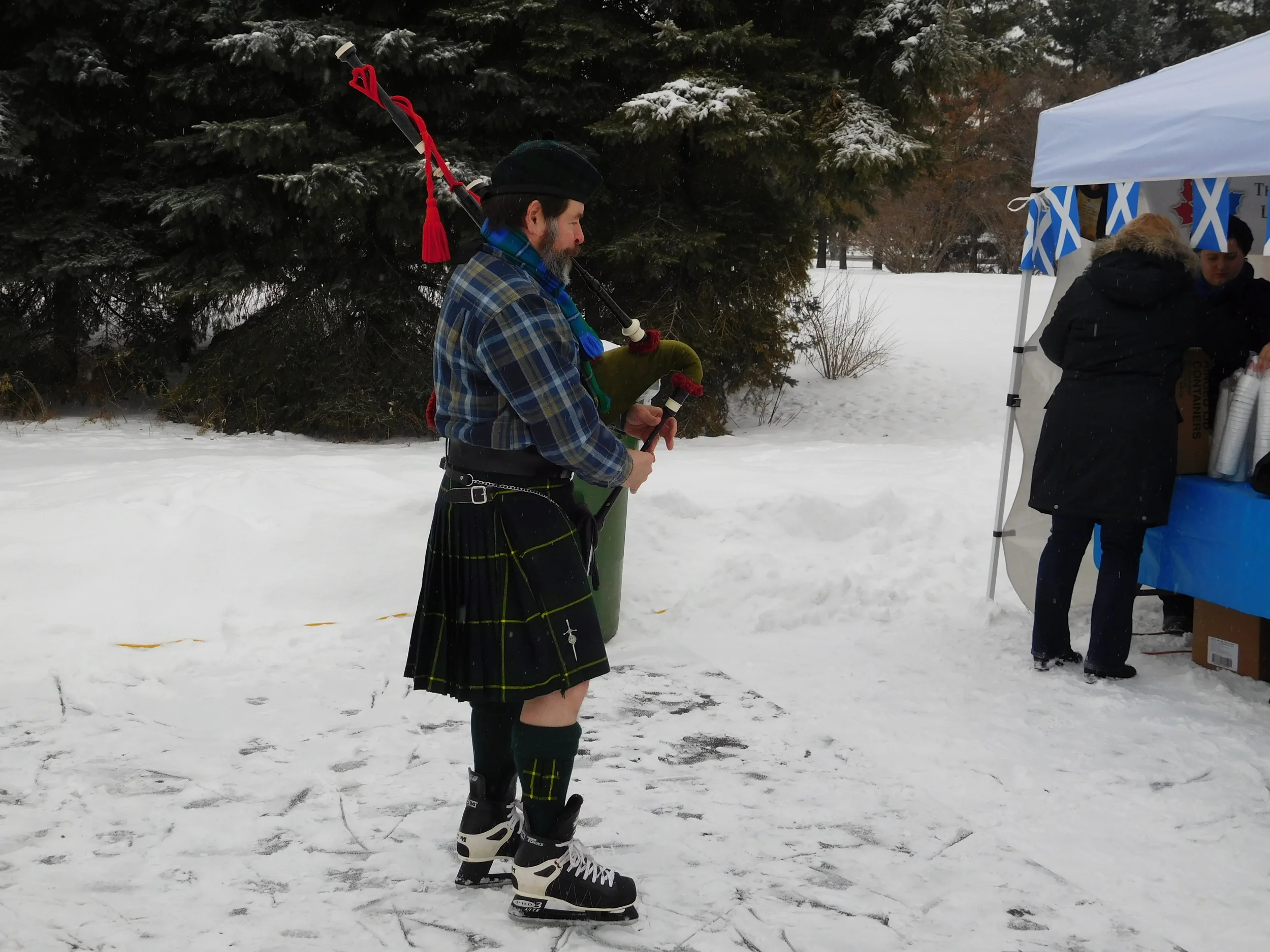 The piper warms up his pipes.