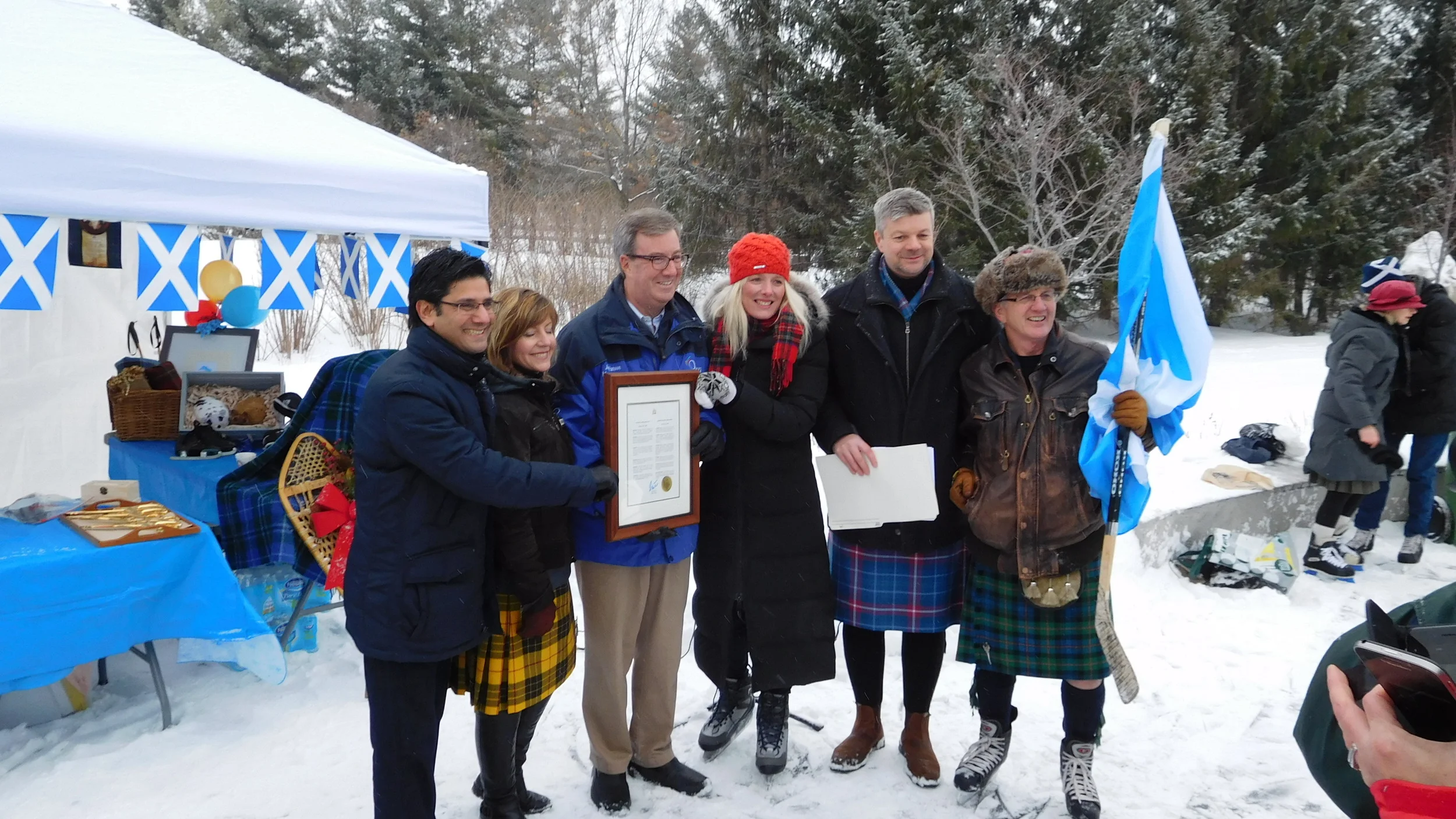 ....while the official party poses for pix. Left to right: Ottawa Centre MPP Yasir Naqvi, SSO Secretary Heather Theoret; Mayor Jim Watson; Ottawa Centre MP Catherine McKenna; SSO Executive Director John Ivison; SSO Skater-in-Chief Don Cummer.