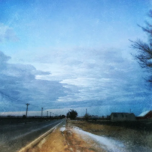 dusky road, barns and light poles.jpg