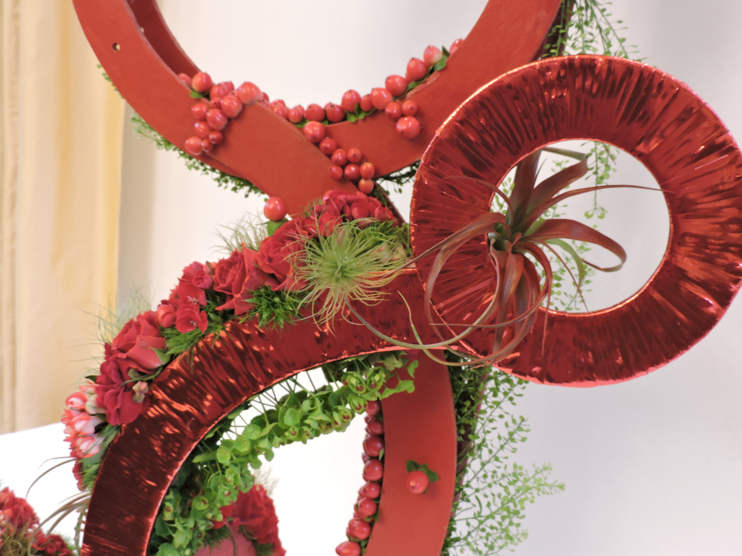 Ribbon was wrapped around some of the pieces to add contrast. Euphorbia is placed to take advantage of transparency within it.