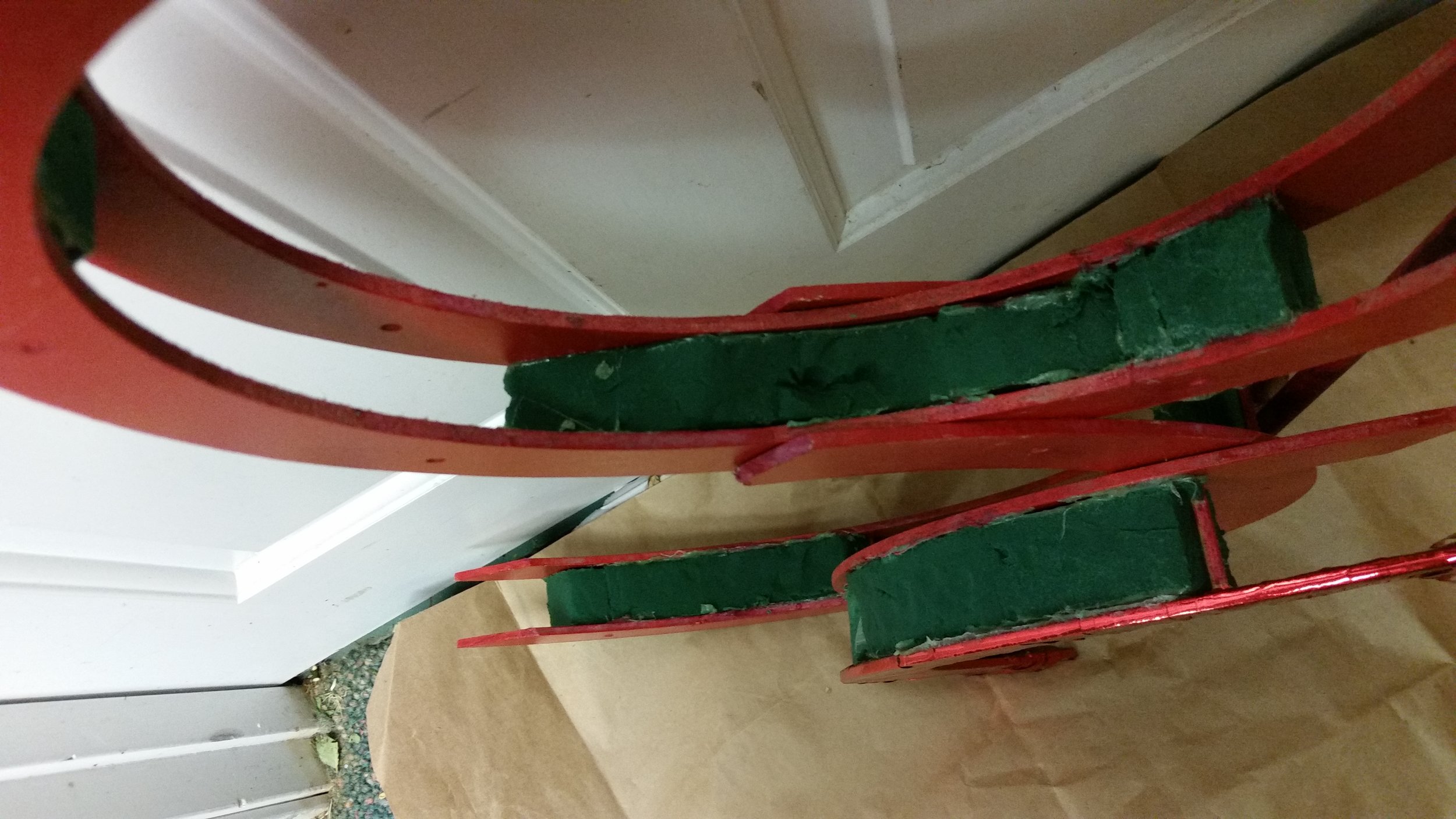 Oasis pan-glued and placed between MDF pieces. Dowel rods provide extra stabilization