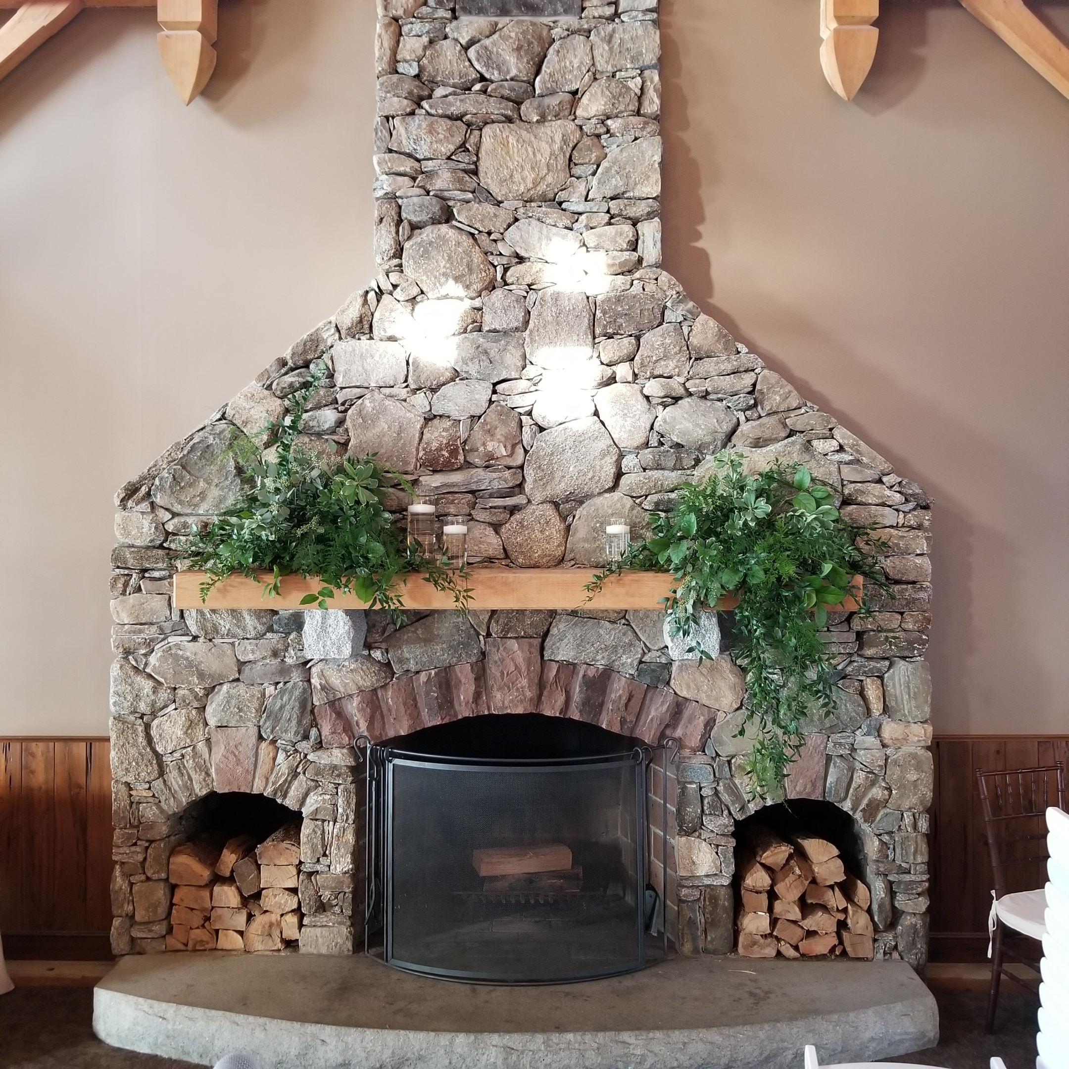 Harrington Farm Fireplace - greenery and floating candles.jpg