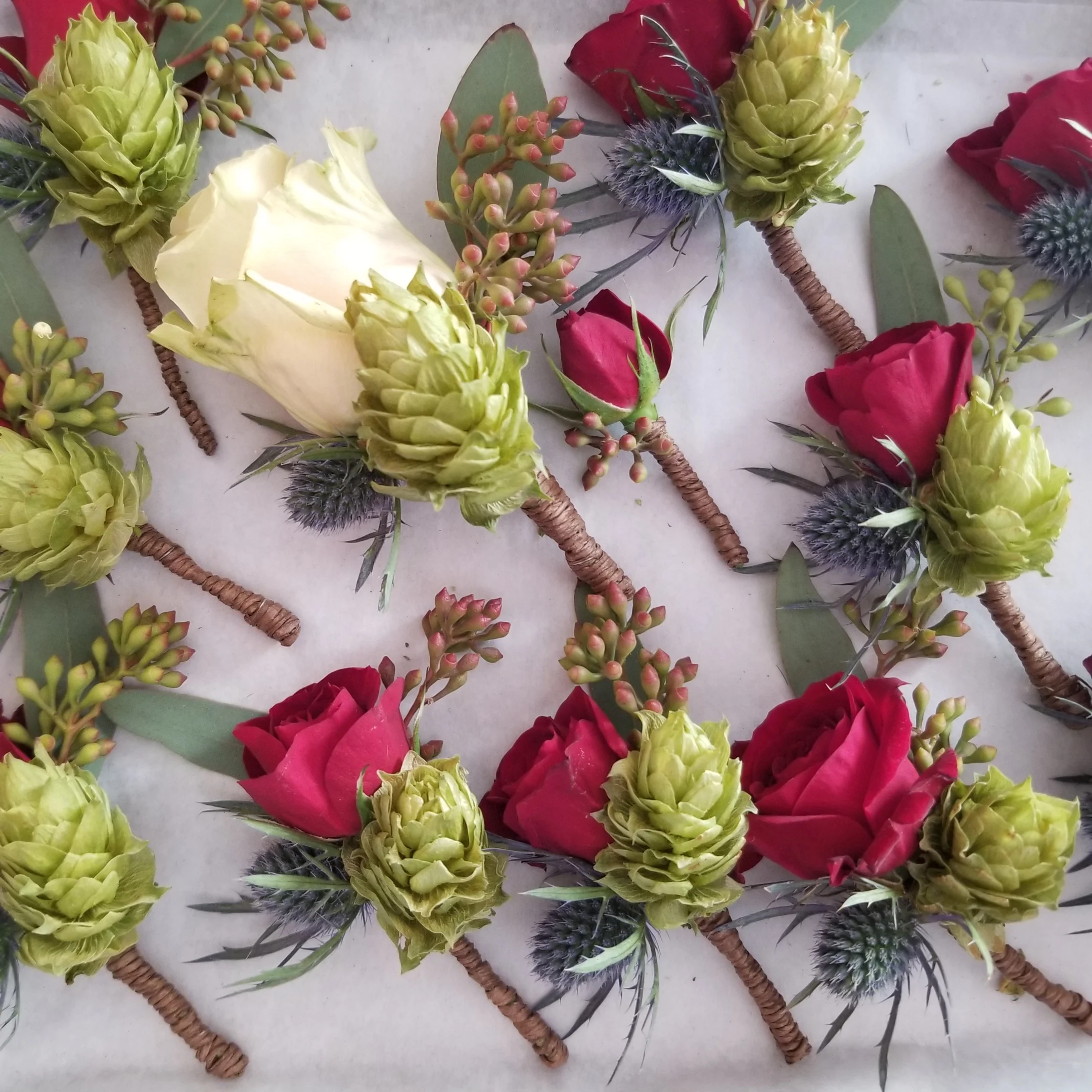 Boutonnieres with hops grown by the couple. Wedding at Harrington Farm, Princeton, MA