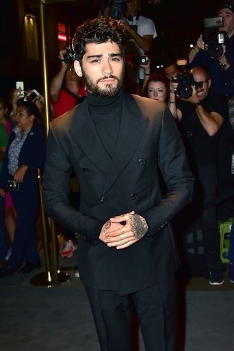 Zayn Malik attending the Tom Ford Fashion Show, Photo credit to Brian Killian