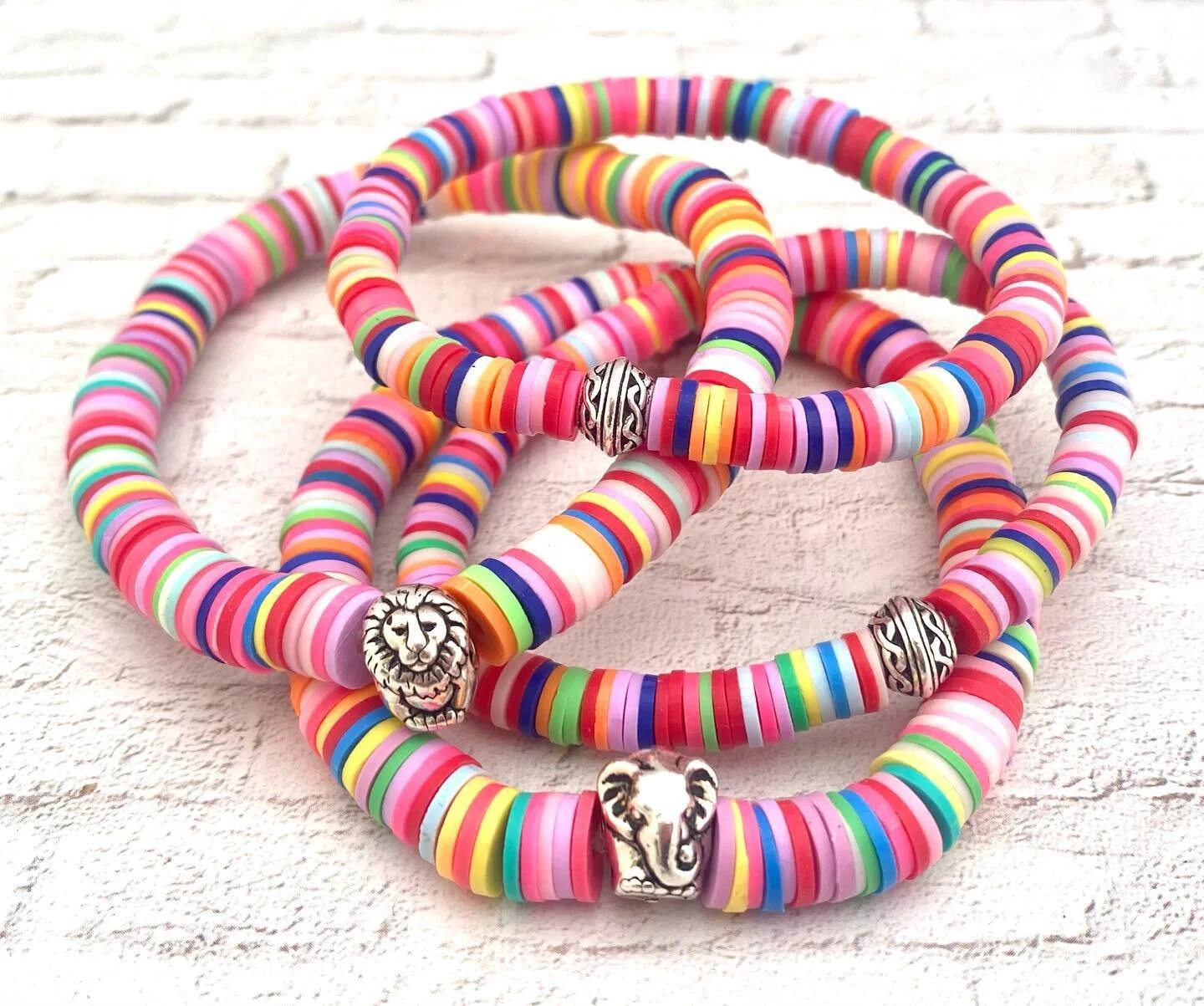I know. I&rsquo;m the stone gal. But these are just fun for spring!  #polymerclay #springfashion #colorfulbracelets #elephant #lion #celtic @lotusandlava #lotusandlava Email: lisalotusandlava@gmail.com