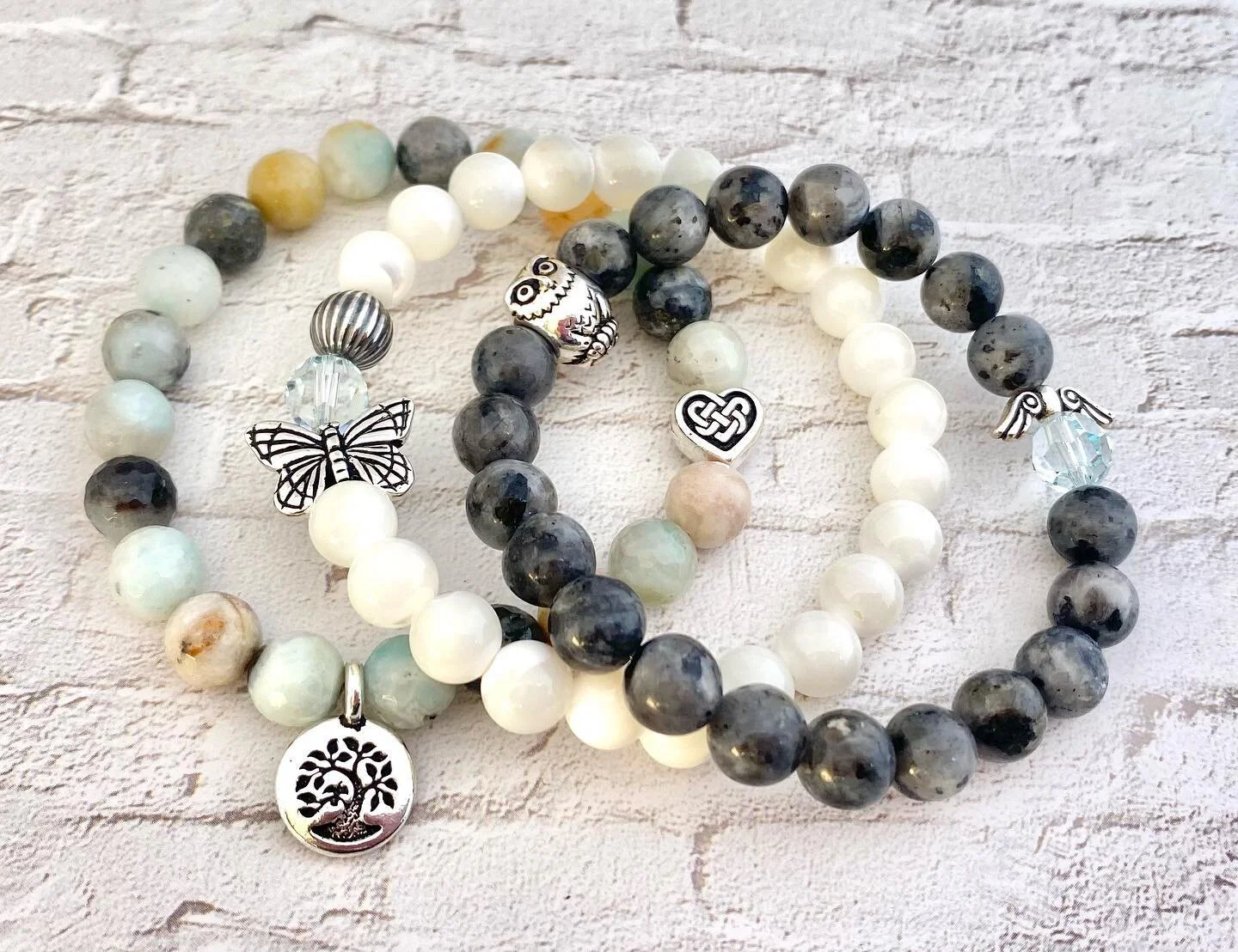 Happy Sunday Funday Ya&rsquo;ll!!! Enjoy life please!  Bottom: #amazonite #treeoflife #celtic Middle: #motherofpearl #butterfly Top: #larvakite #owl #angelwings #outstandingtriplestack  @lotusandlava Email: lisalotusandlava@gmail.com  Website: lotusa