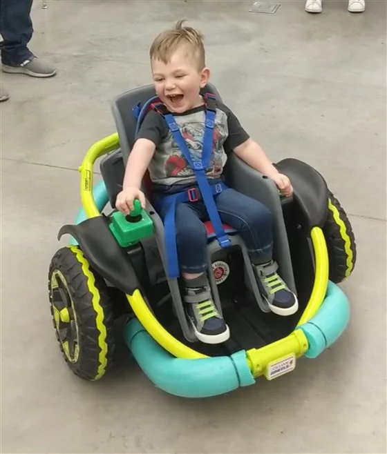 High school robotics team builds electric wheelchair for 2 year old 