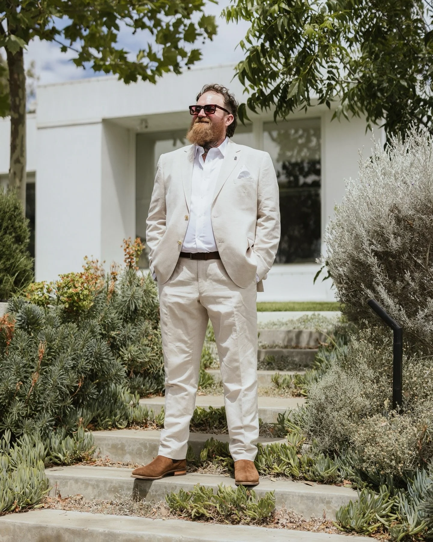 J A S M I N E +  A N G U S

Jasmine and Angus chose Port Willunga Beach for their wedding day, and the place absolutely showed up for them. That stretch of coast has a kind of quiet magic to it. The soft sand, the weathered cliffs, the sound of the w
