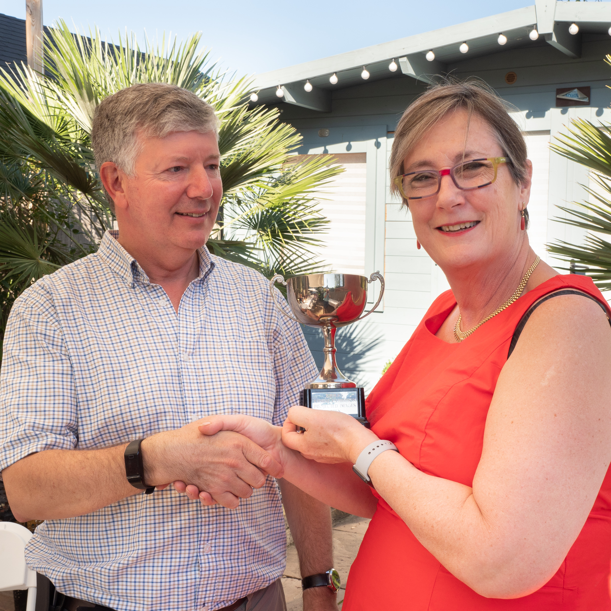 Kristin Mason receives her first trophy from EHHPS President Phil Dean