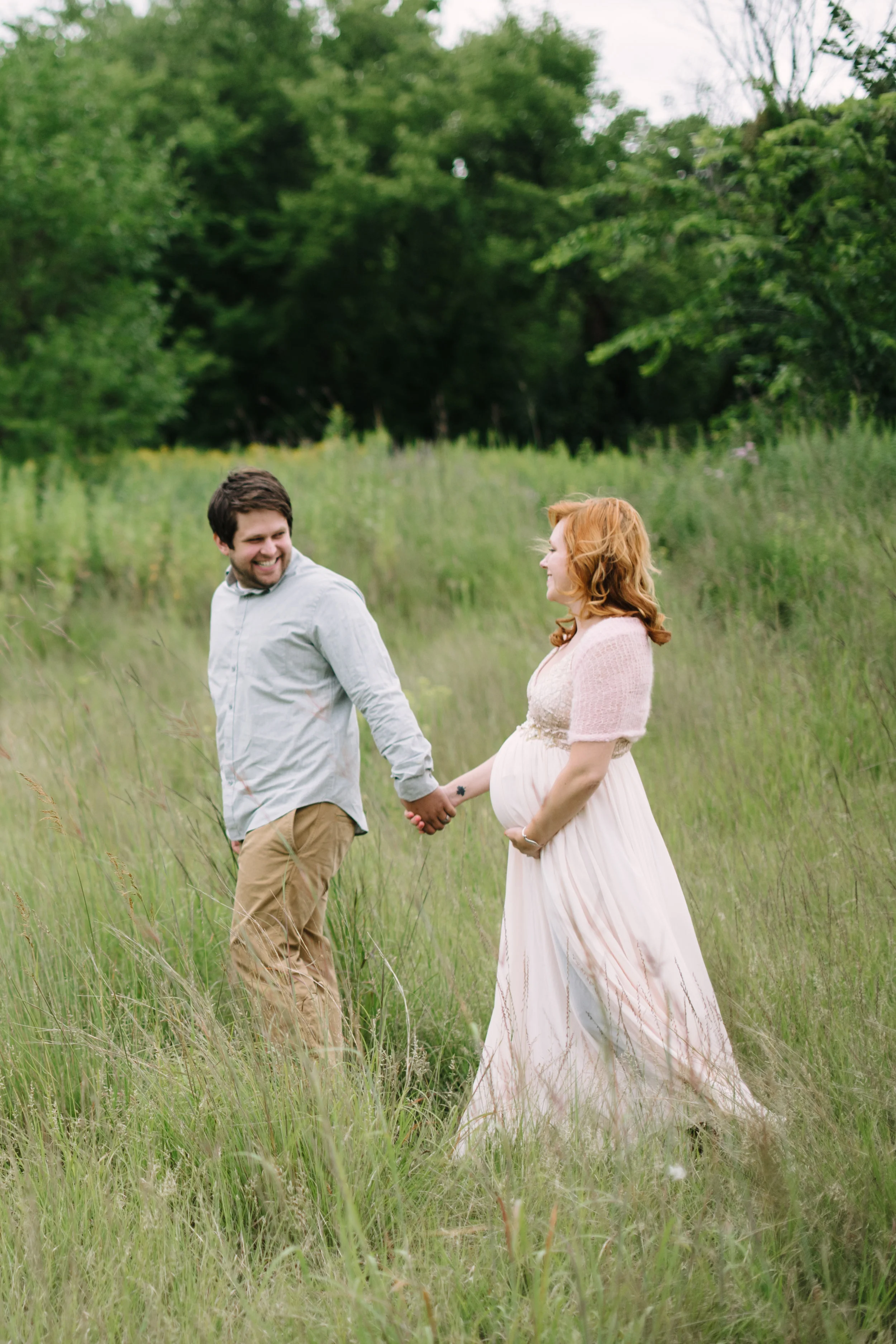 Doug and I prepare for the arrival of our baby girl in whimsical maternity photos, wearing soft pink, khaki, and light grey.