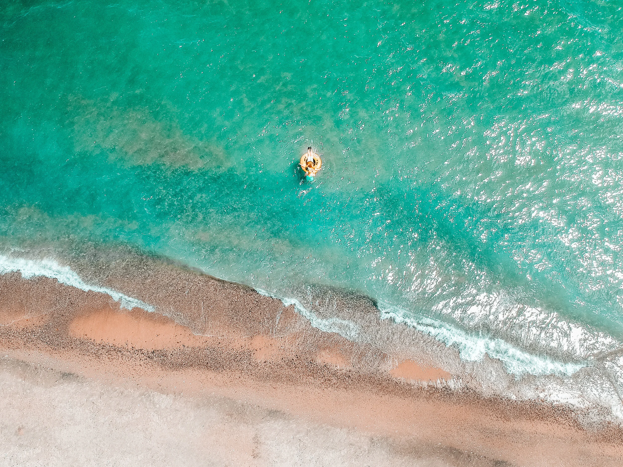  Drone shot of some family members swimming in Lake Huron in Harrisville Michigan. 