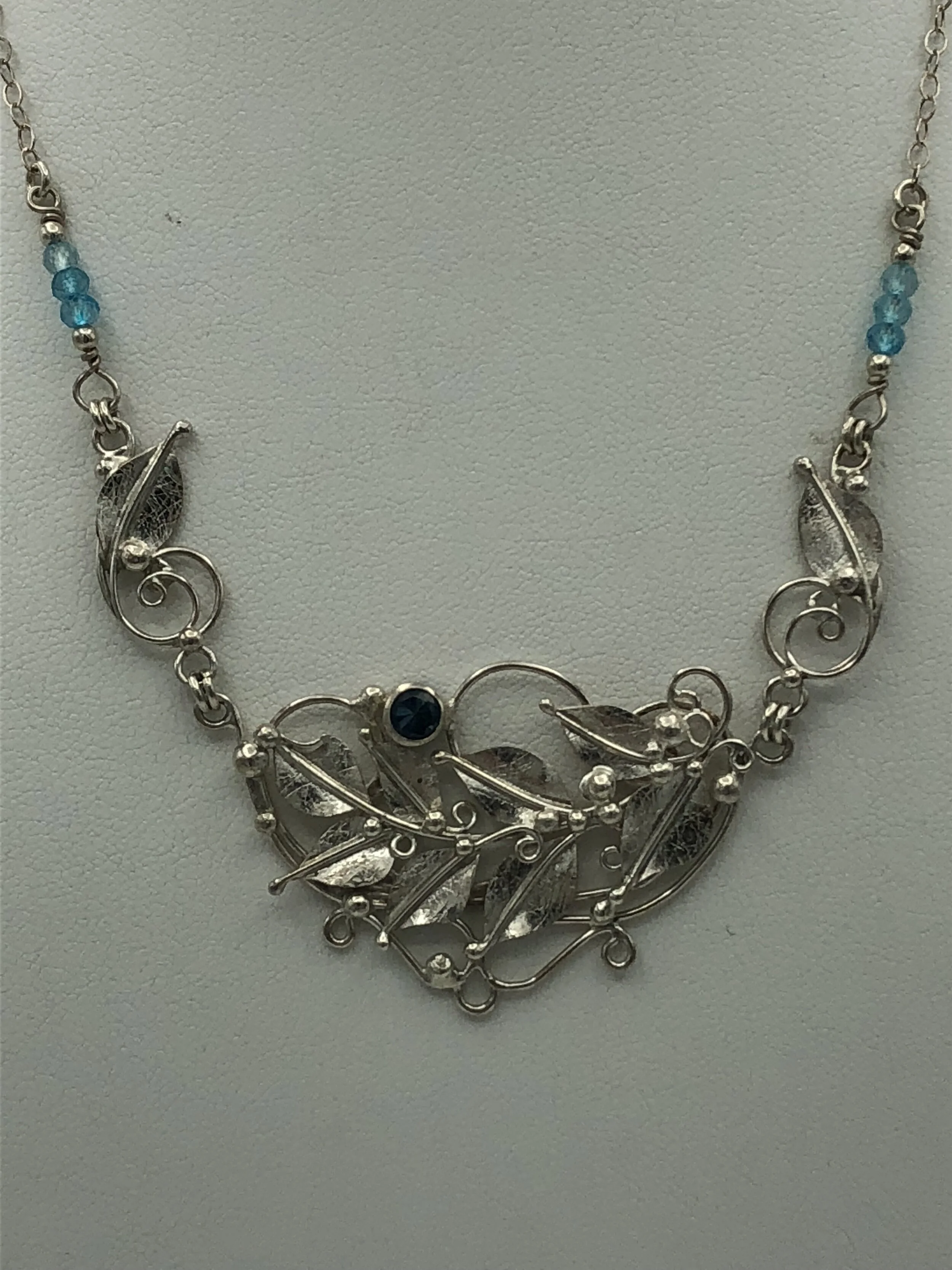 Elizabeth	Best	Floral Necklace w/Blue Topaz	Sterling Silver	$120 