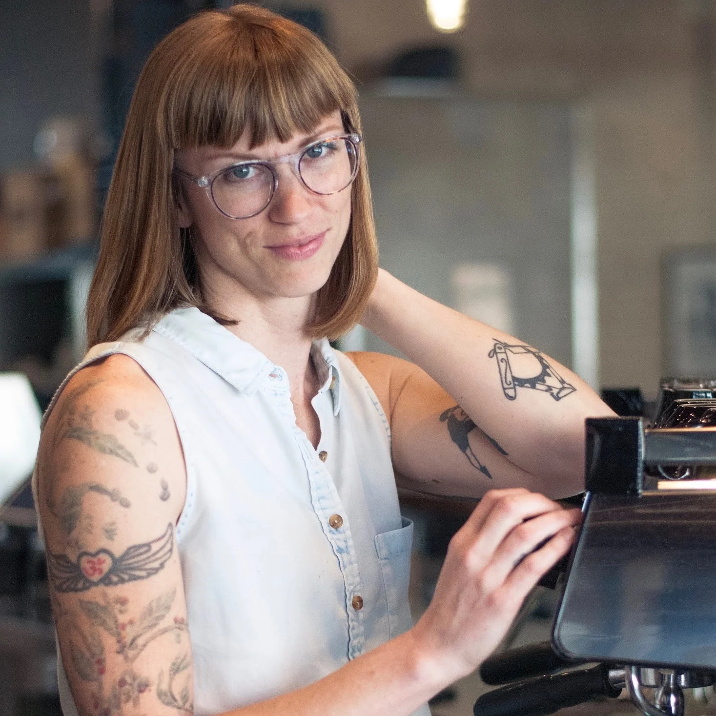 Noelle Archibald "Noelle Archibald is the Co-Owner of Lamplighter Coffee Roasters in Richmond Va where she actively manages both their Retail and Wholesale operations. She and her partners opened their first shop in 2009 in an old service garage without any traditional business resources. With a focus on well sourced and crafted coffee, beverages, and food it quickly grew to be a thriving company that has been recognized as one of the best specialty coffee shops in America. As a long time social activist, musician, artist, and organizer Noelle sees her work in coffee as another platform for expression and connectivity to occur. She believes in the power of community spaces such as coffee shops to provide a rare platform for people of drastically different backgrounds to share space and have meaningful interactions on both sides of the counter. As a mother and human on earth Noelle is dedicated to supporting positive change away from the dominant paradigm of oppressive power structures. "