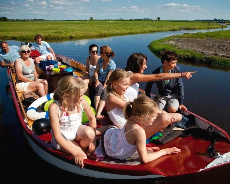 people enjoying a whisper boat in the Dutch countryside