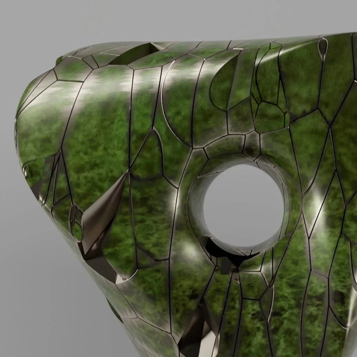 A modern, abstract sculpture resembling a geometric, irregularly shaped object with green and black surface textures, mounted on a black base.