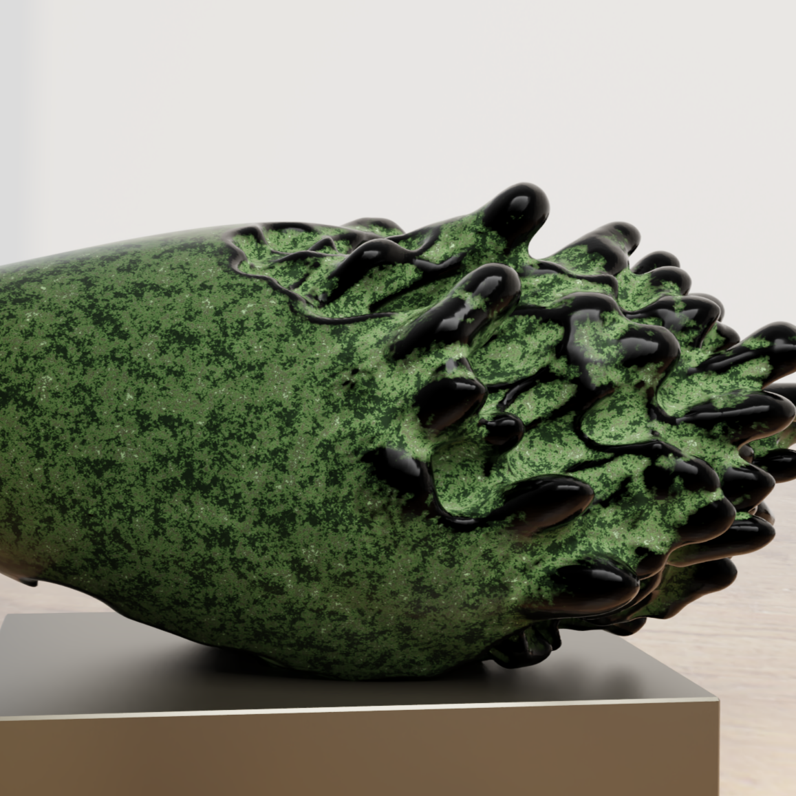 Contemporary sculpture of a green watermelon with a black chain wrapped around it, displayed on a beige pedestal in an art gallery.