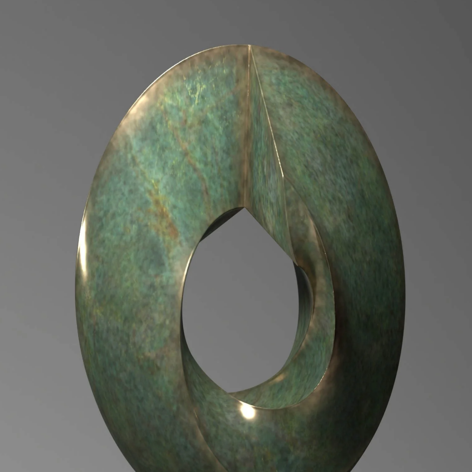 A sculpture of a crescent shape with a textured greenish iridescent surface, mounted on a rectangular black base against a gray background.