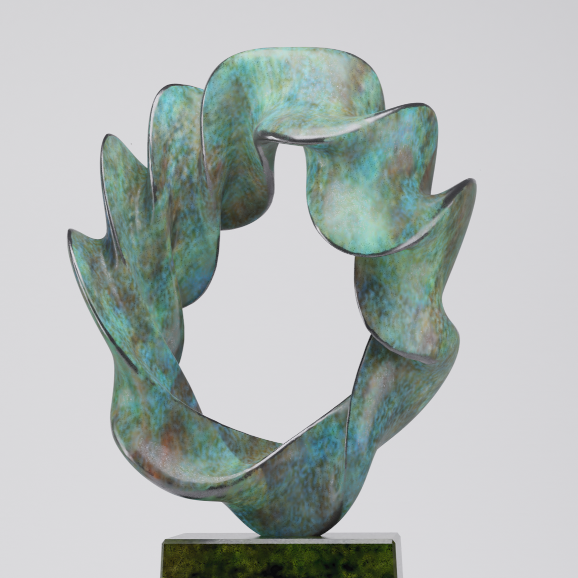 A sculpture of a hand in a gesturing pose, made of a material with a colorful, mottled pattern resembling a blend of green, blue, and brown hues, standing on a rectangular dark green base.