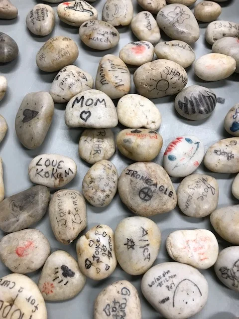 Rocks with Messages, Names, and Drawings Honouring Loved Ones Living with Dementia.