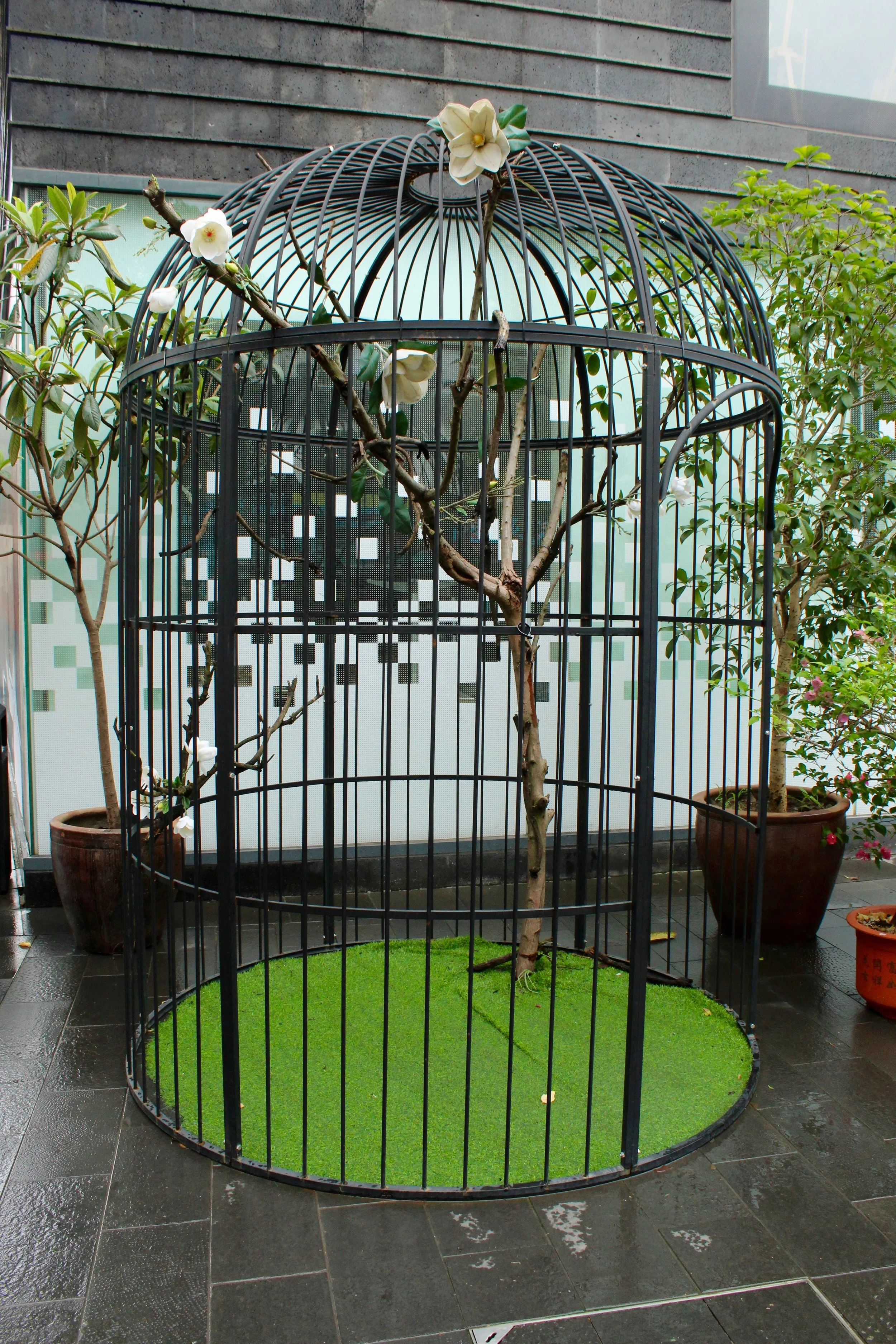 A human sized bird cage located at the entrance to the Old town in Zhujiajiao. 