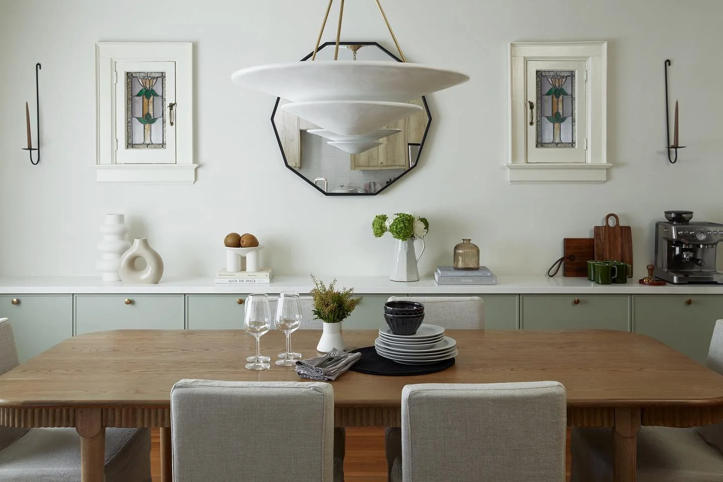 NEW PROJECT

This hundred year old house got a modern renovation without compromising on the original charm. Keeping the original hardwood floors, drawing inspiration from the original stained glass windows, and adding lots of storage throughout make