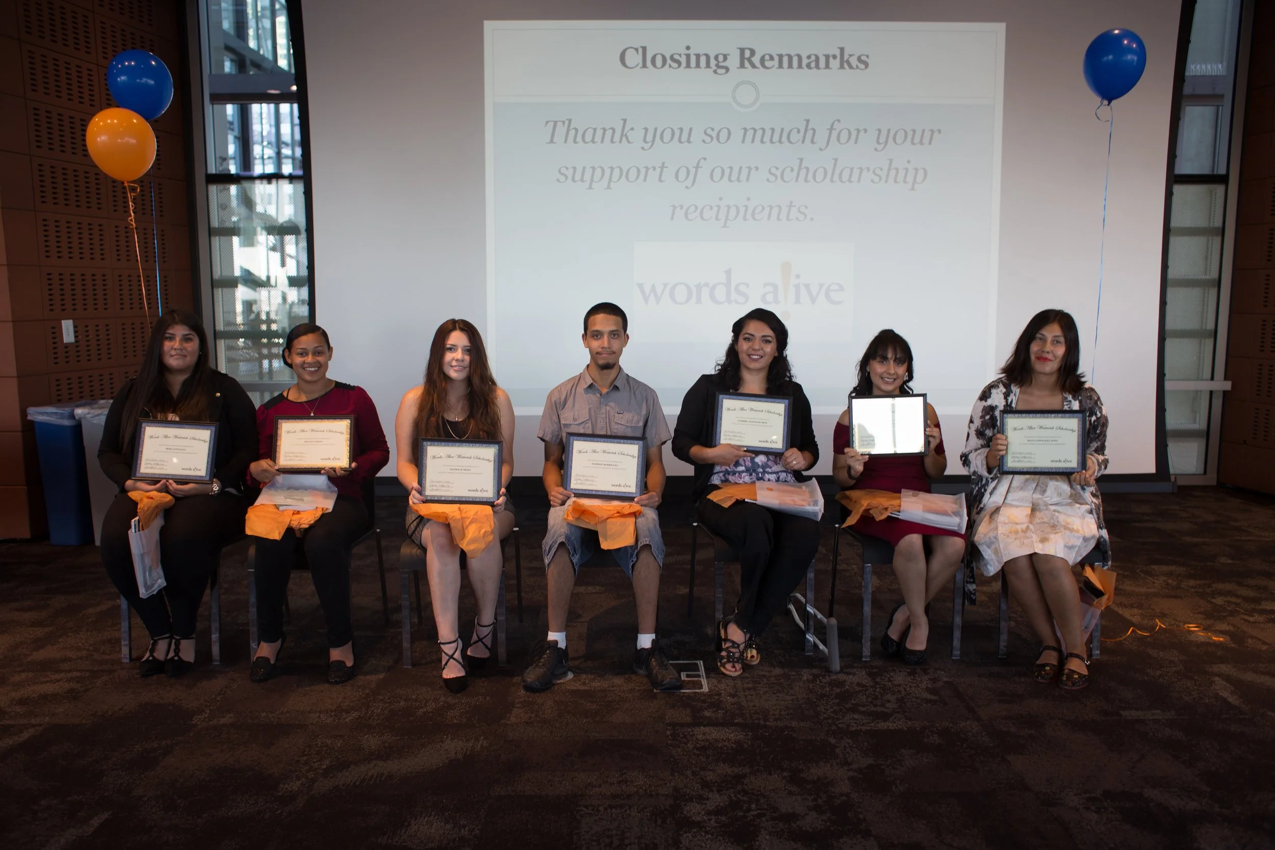 Image: Seven of the Words Alive Westreich Scholarship Students sit in a row displaying their awards at last year's Scholarship Ceremony. 