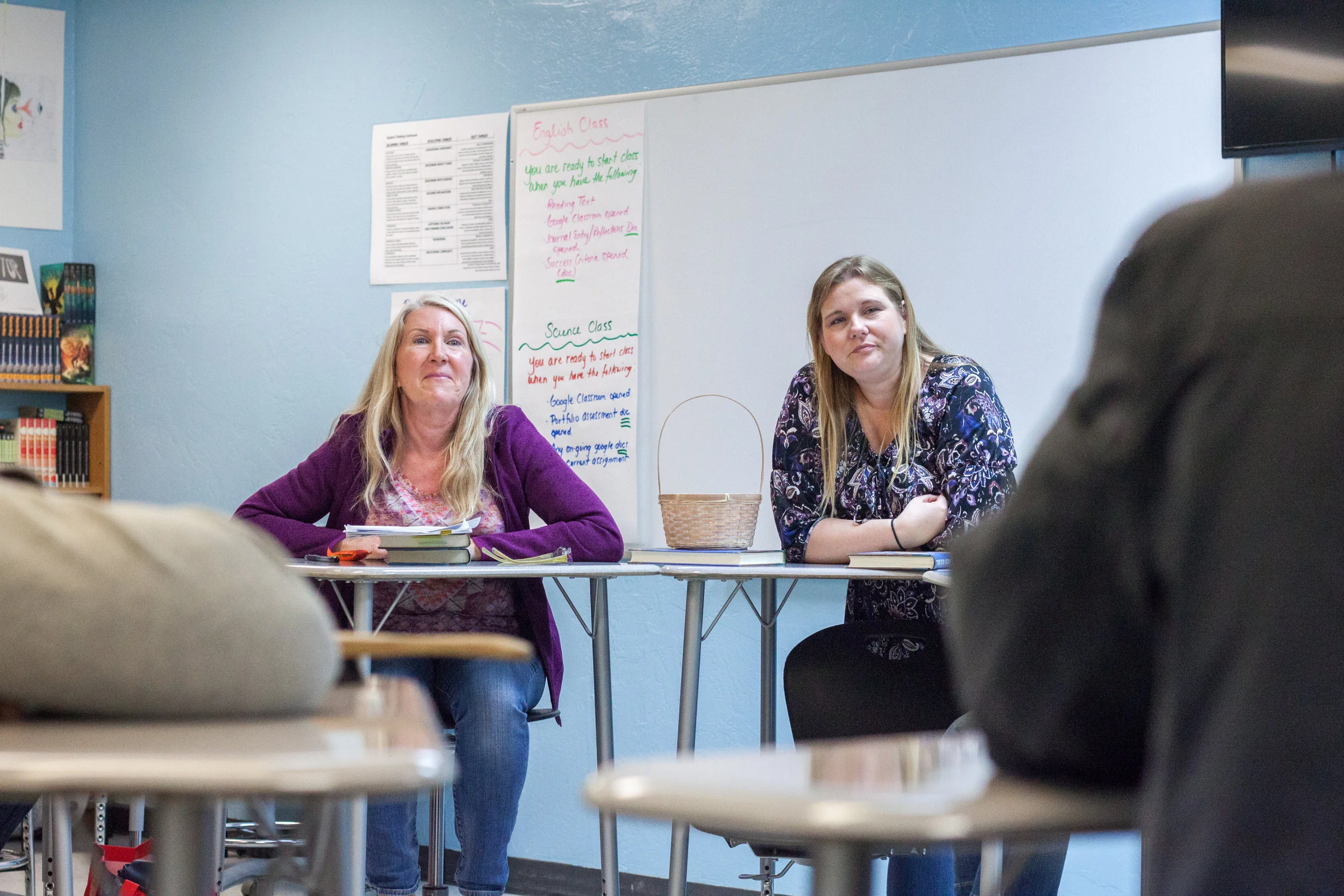 Two of our Adolescent Book Group volunteers facilitating a book discussion at La Mesa Blended Community School. Photo credit: goldfacephoto.com
