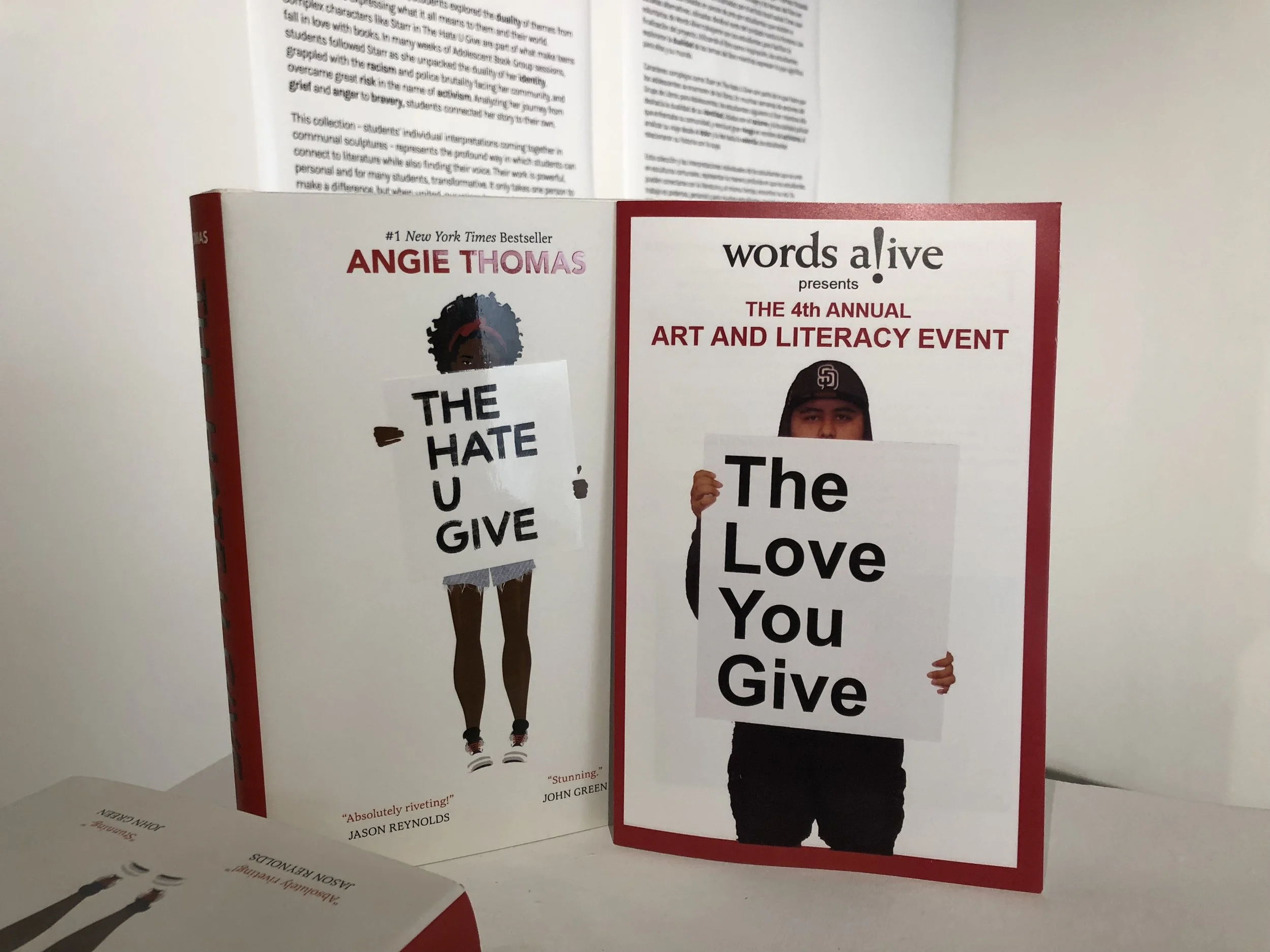 An image of the Words Alive program for The Love You Give next to the book cover for The Hate U Give.