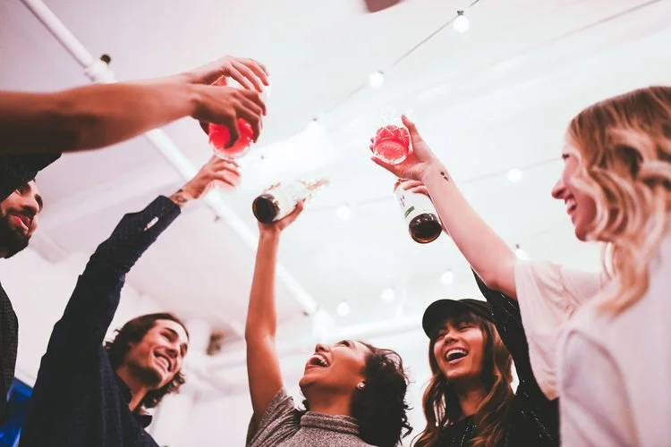 Image of several people toasting with glasses of Boochcraft kombucha. Source: Boochcraft
