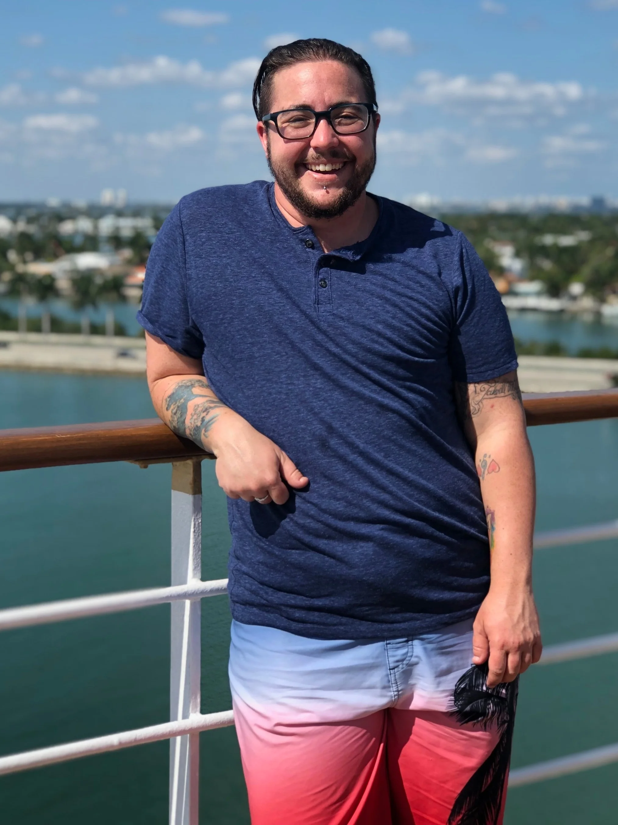 An image of Robyn standing in front of a large body of water.