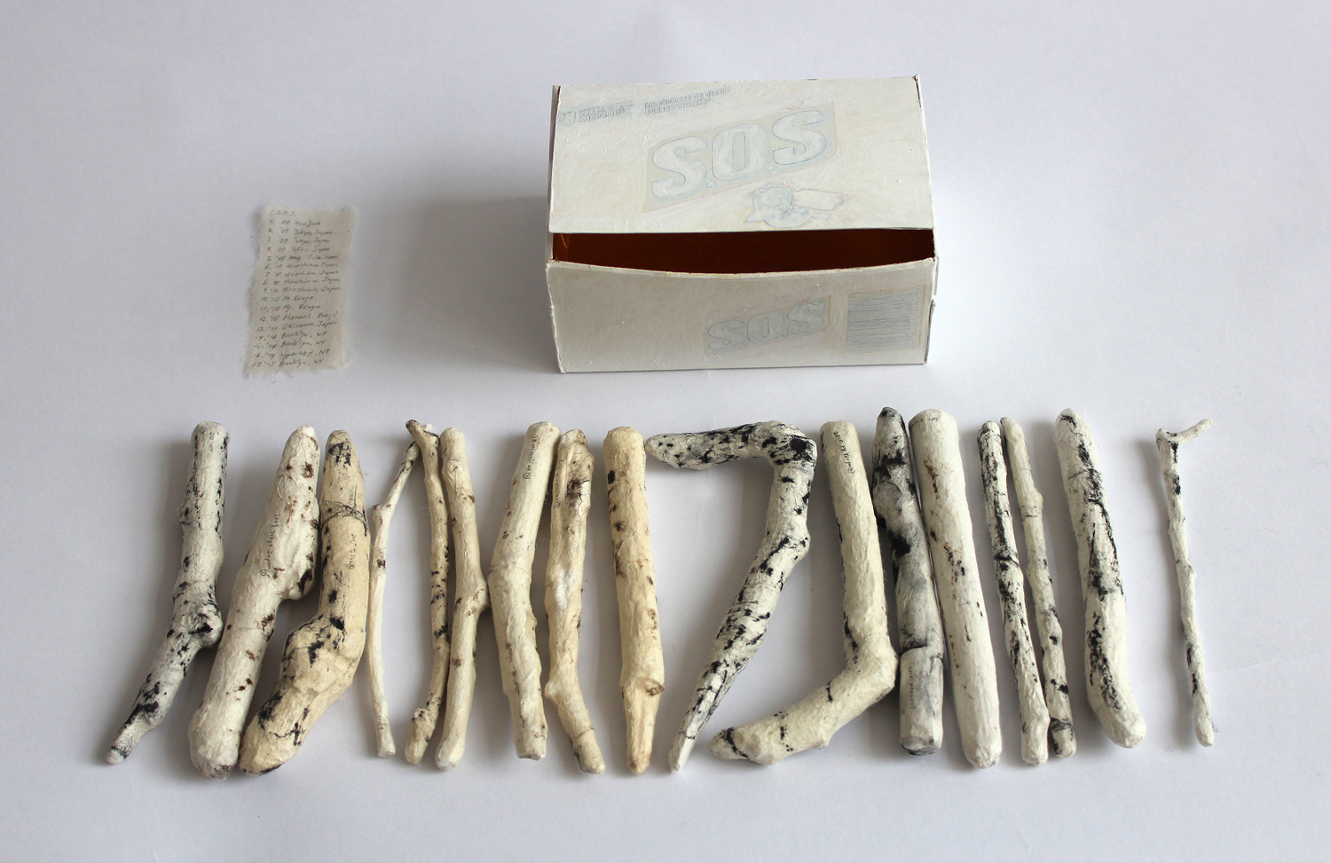 Box_S.O.S 2015 Used box, 17 tree branches, washi, charcoal, acrylic, shell powder, glodleaf 5.1" x 3.1" x 2.4"