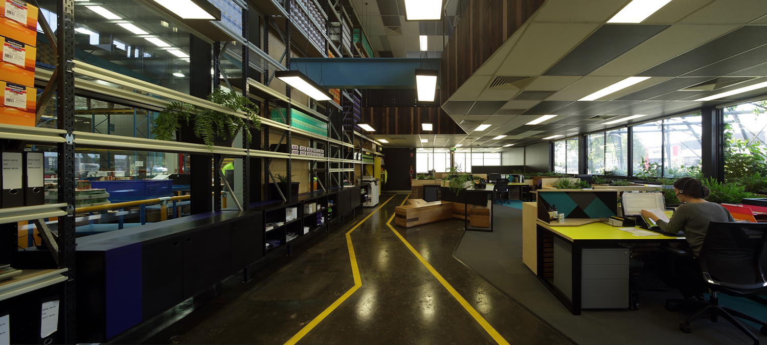 A connection between the office and factory makes workers feel like part of one team and also gives visitors a look behind the scenes at how the products are made.