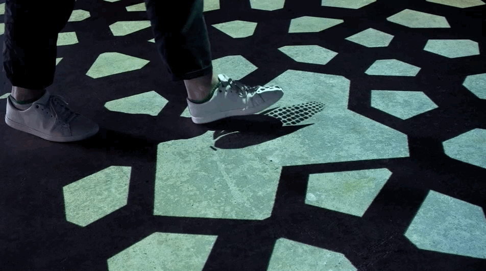 Stepping on tiles activates stories that travel to the central sculpture 