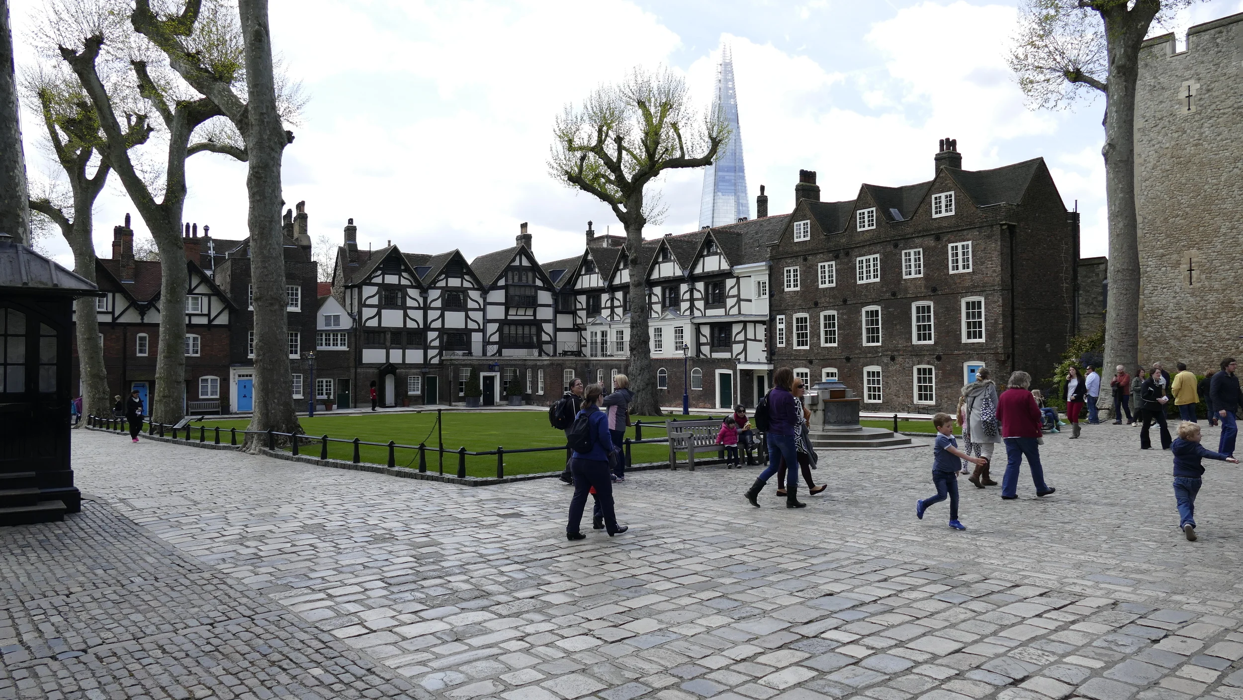 Some of the homes of the residents of the Tower of London. The Beefeaters & their families and others live within the walls. That is the Spire building in the background.