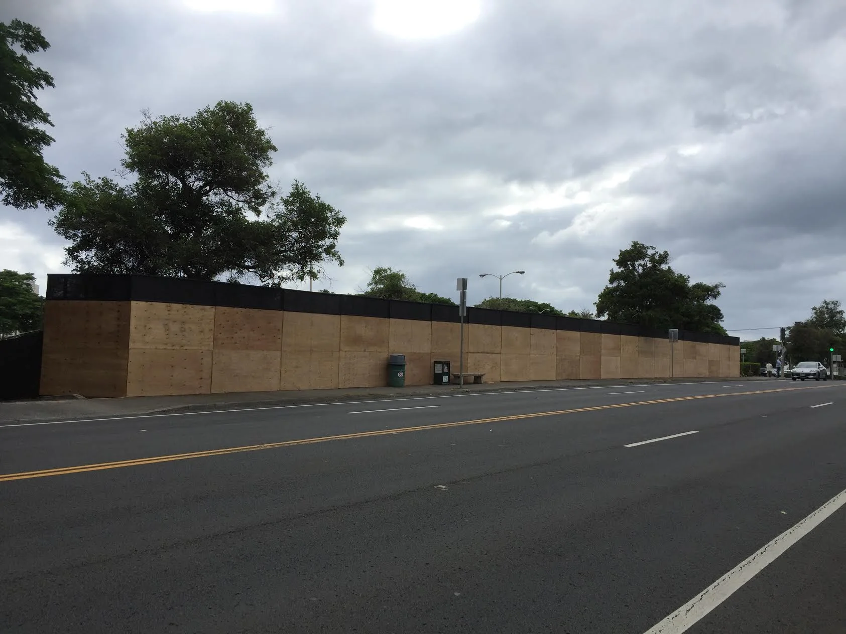 Here is what the original plywood barricade looked like. It's going to be so much better with art on it! Please also visit: www.hawaii.edu/art/art-at-large/ to see more images and read the various artists' statements about their individual pieces.