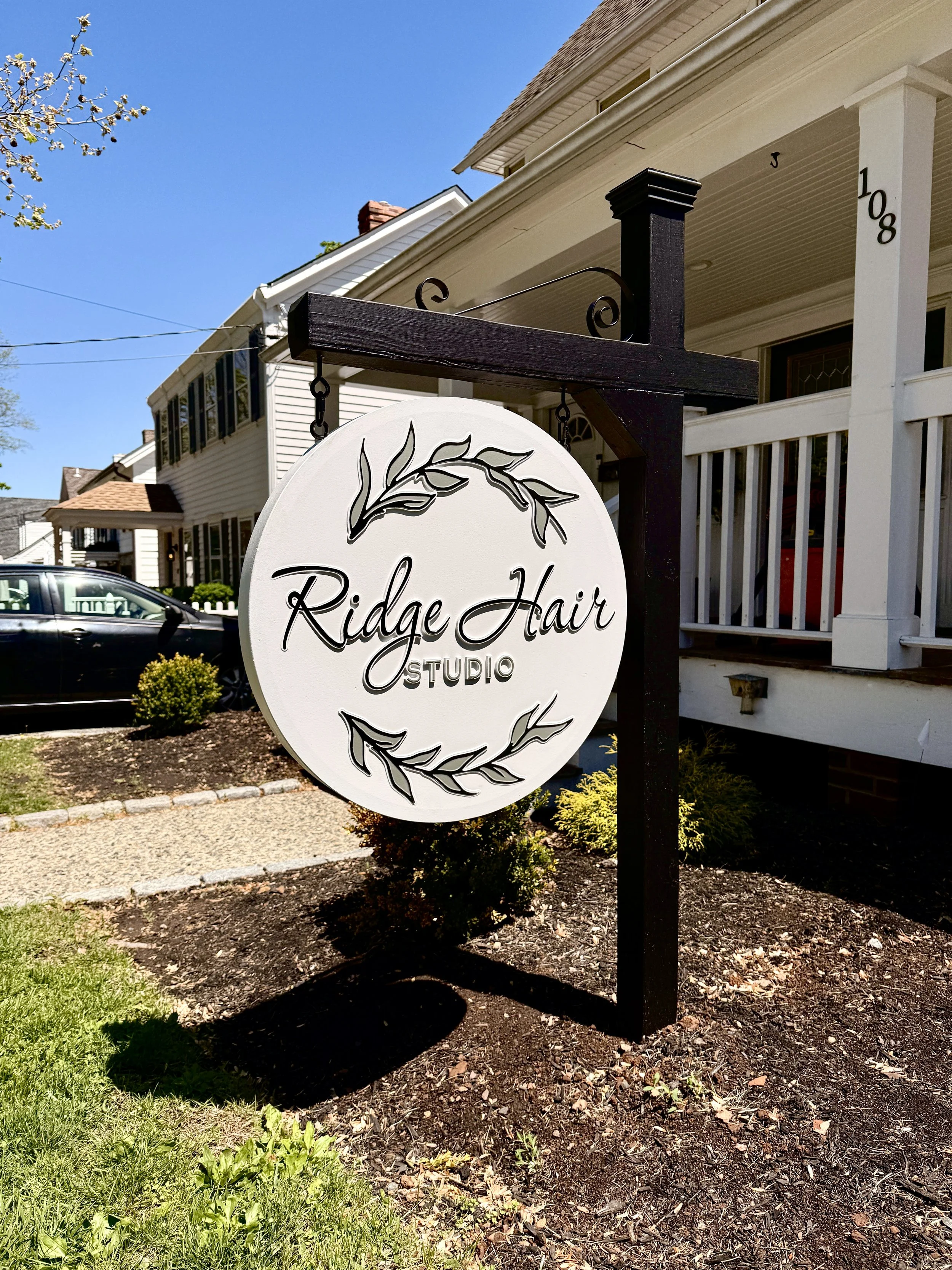 Custom carved and hand-painted HDU sign for Ridge Hair Studio in Basking Ridge, New Jersey