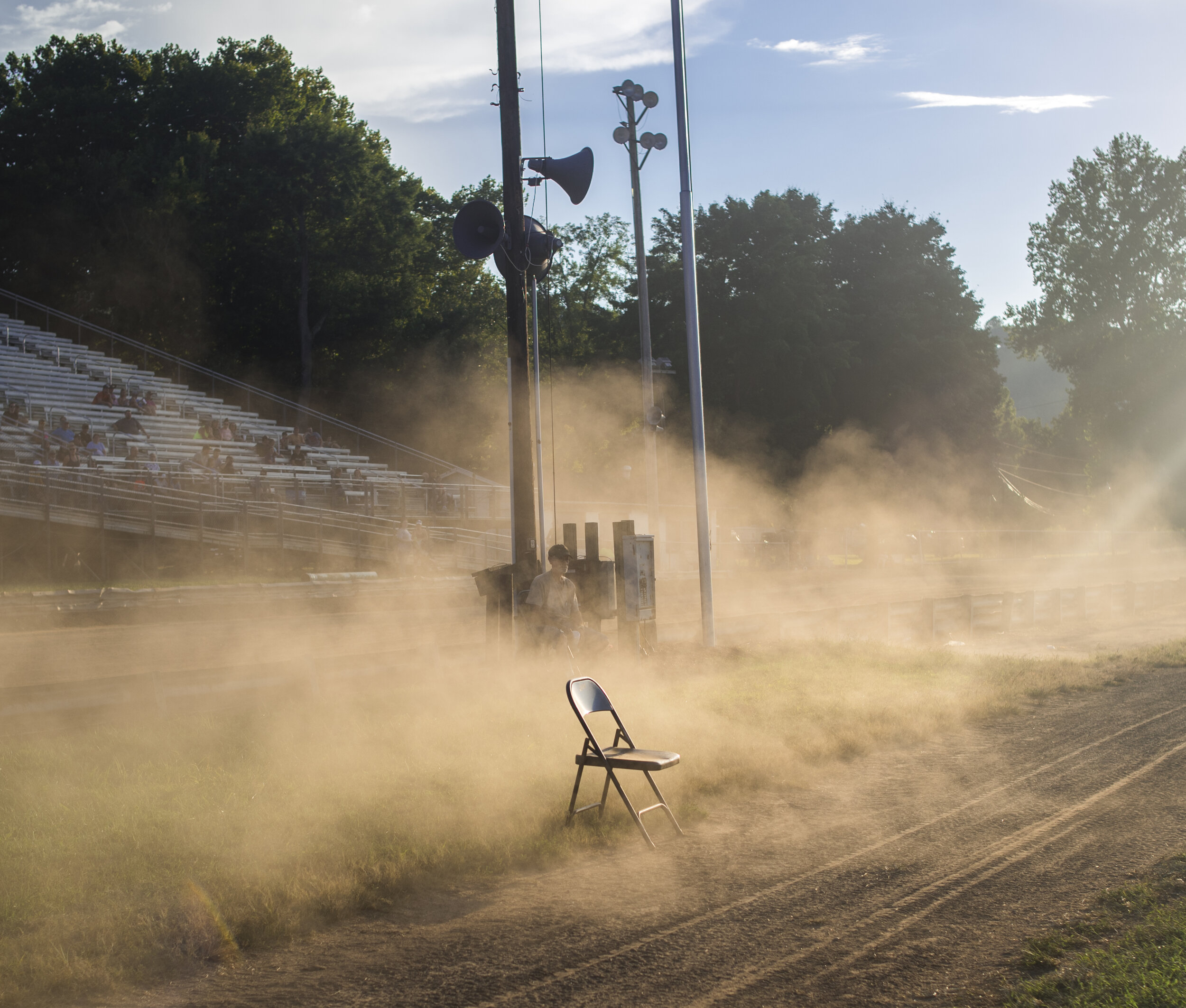  Dust clouds drift after two ATVs drag race on a dirt track in Marietta, Ohio on June 30, 2018.    
